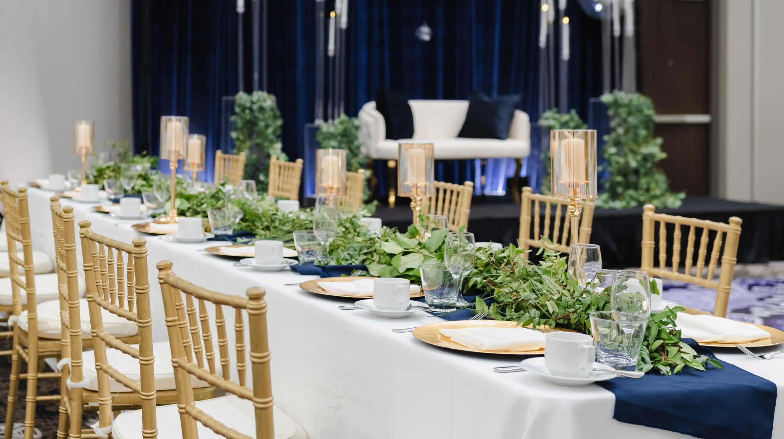 wedding reception table set up in hotel ballroom