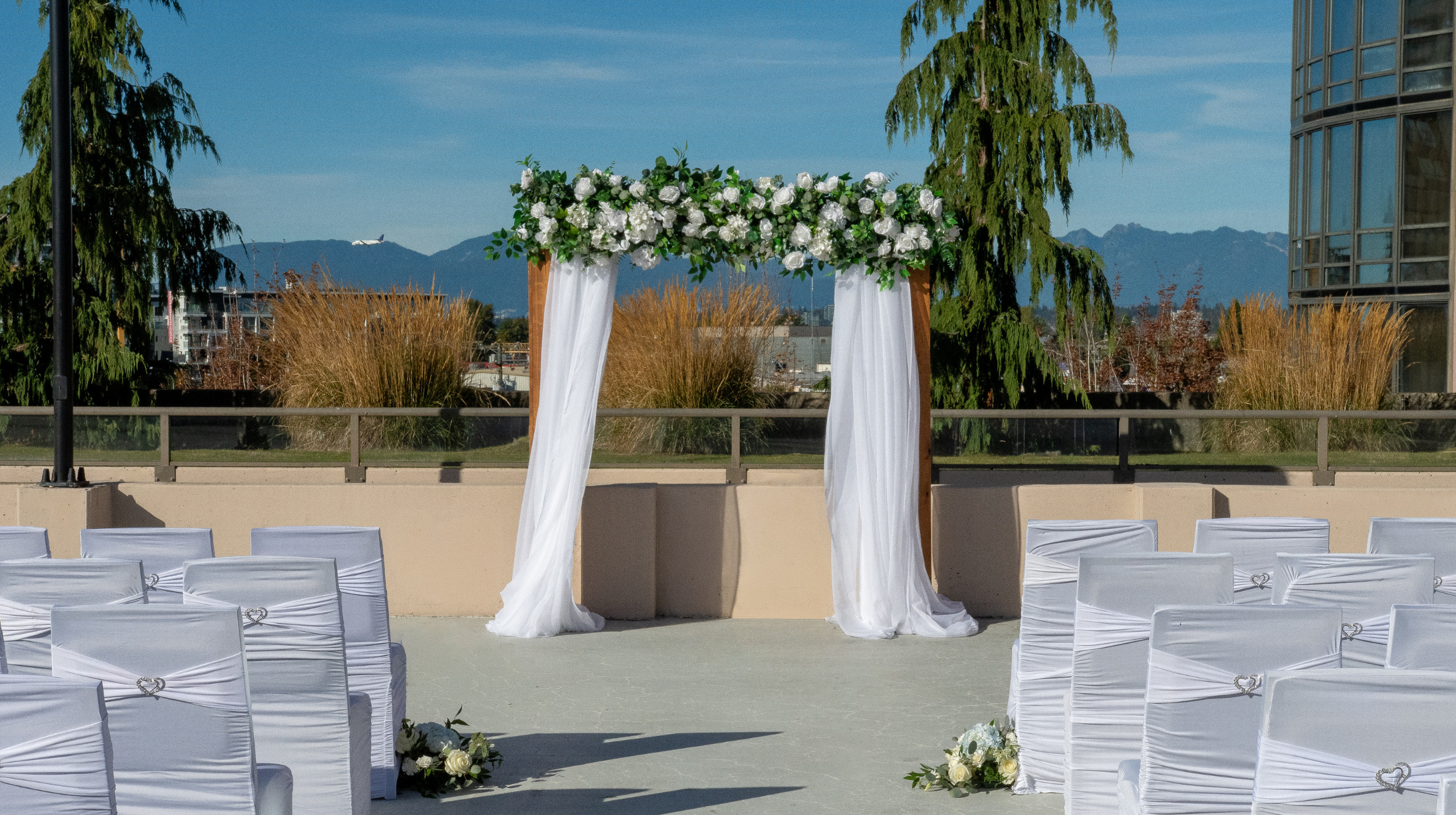 Rooftop outdoor wedding ceremony with mountain views in Richmond, BC