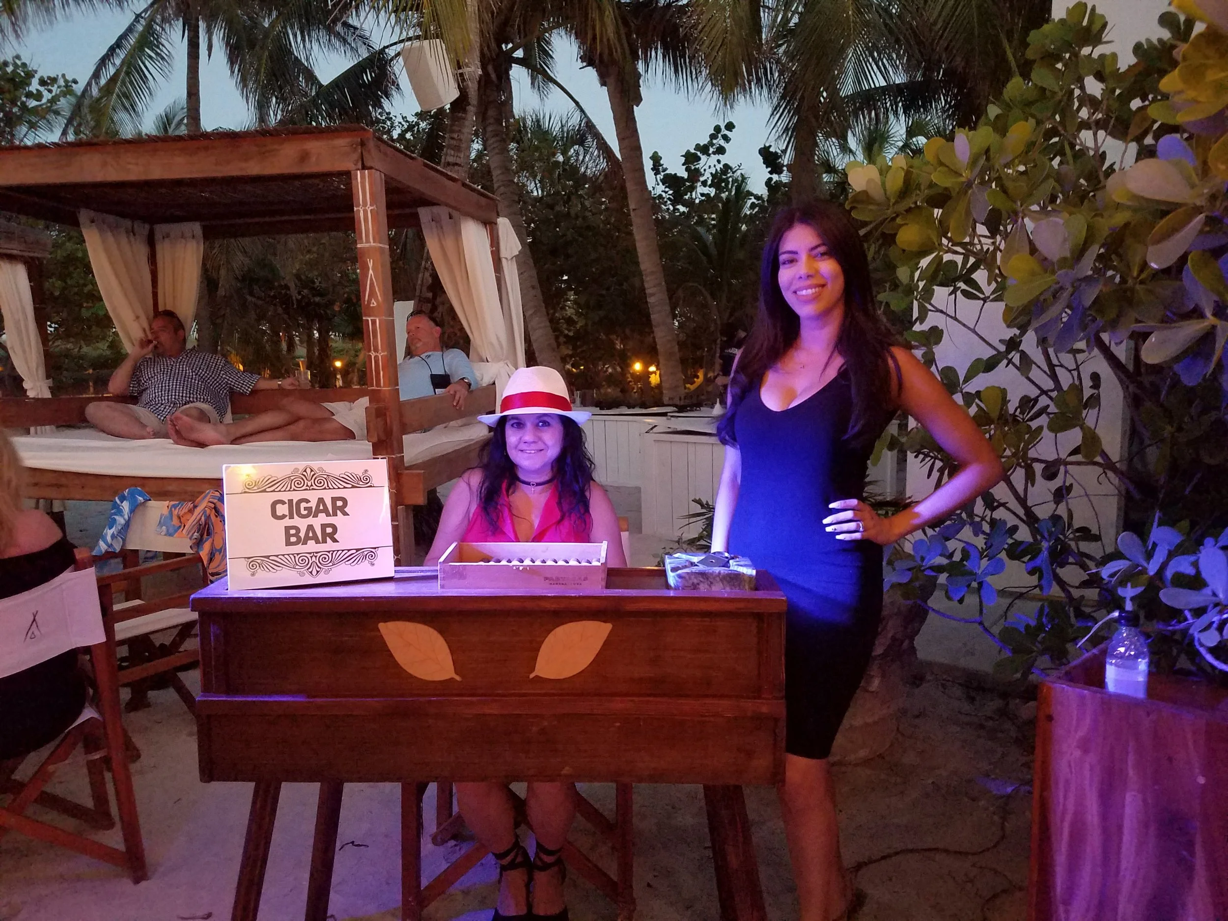 Cigar roller-female w female hostess.jpg
