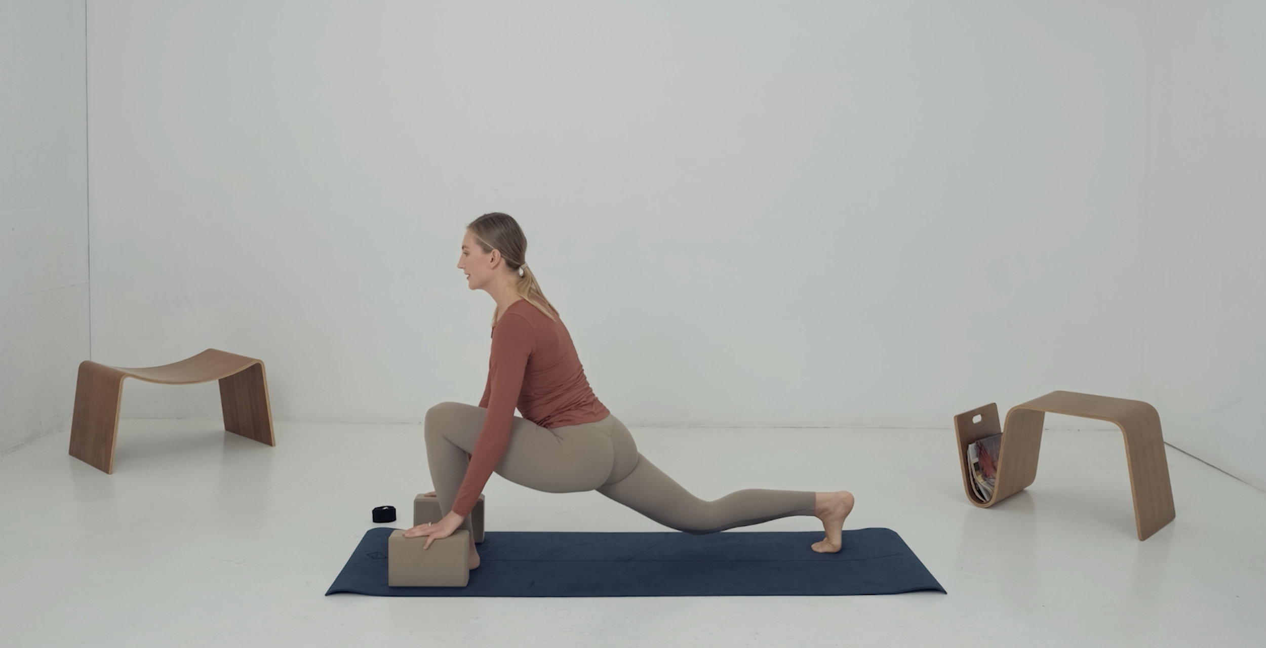 stretching instructor doing low lunge splits preparation exercise