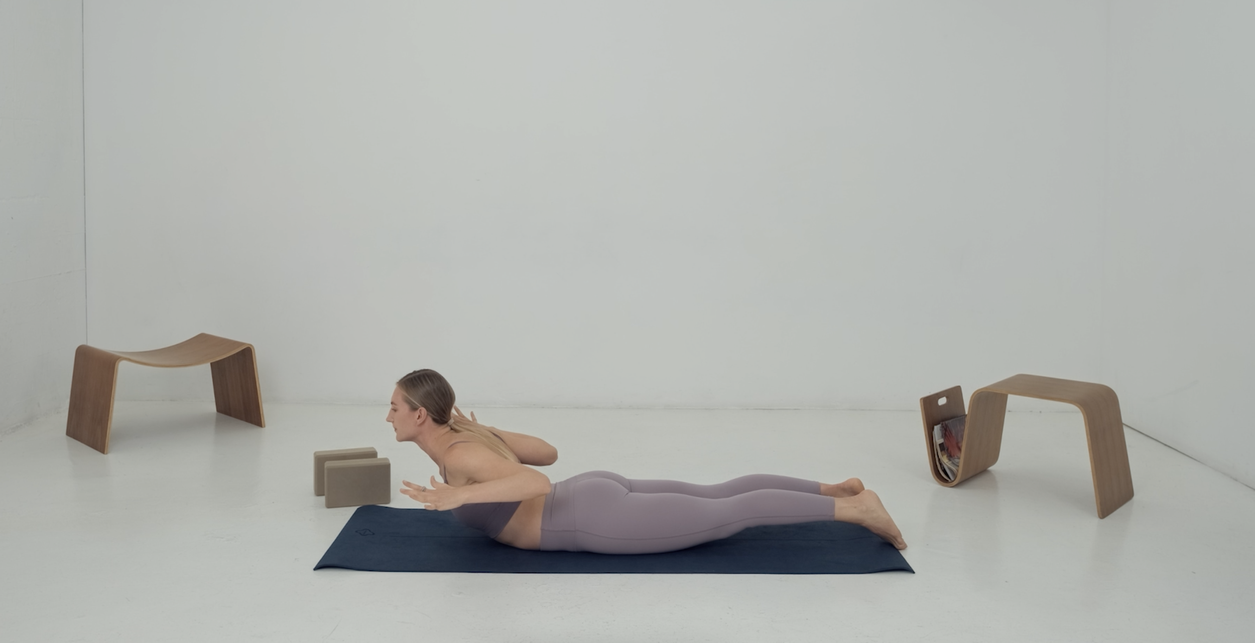 stretching instructor back exercise on mat