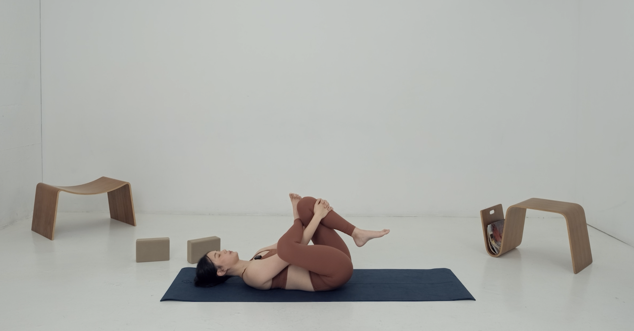 stretching instructor doing rest pose on mat