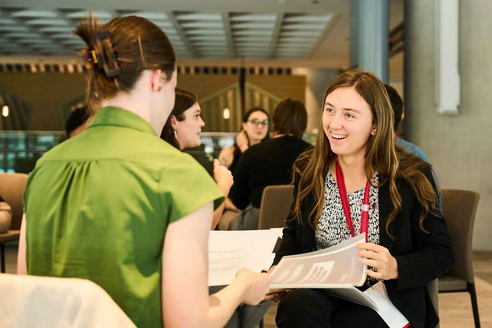 Two women working with Dr. Tiff on workplace mental health initiatives