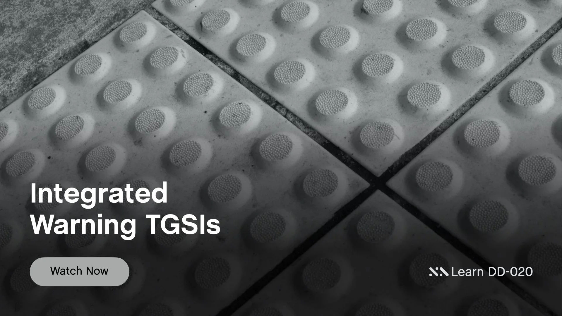 Staebl Academy - Integrated Warning TGSIs - Close-up of tactile paving tiles with raised circular dots, used as a warning cues for vision impaired persons,  text 'Integrated Warning TGSIs' and a button labeled 'Watch Now'.