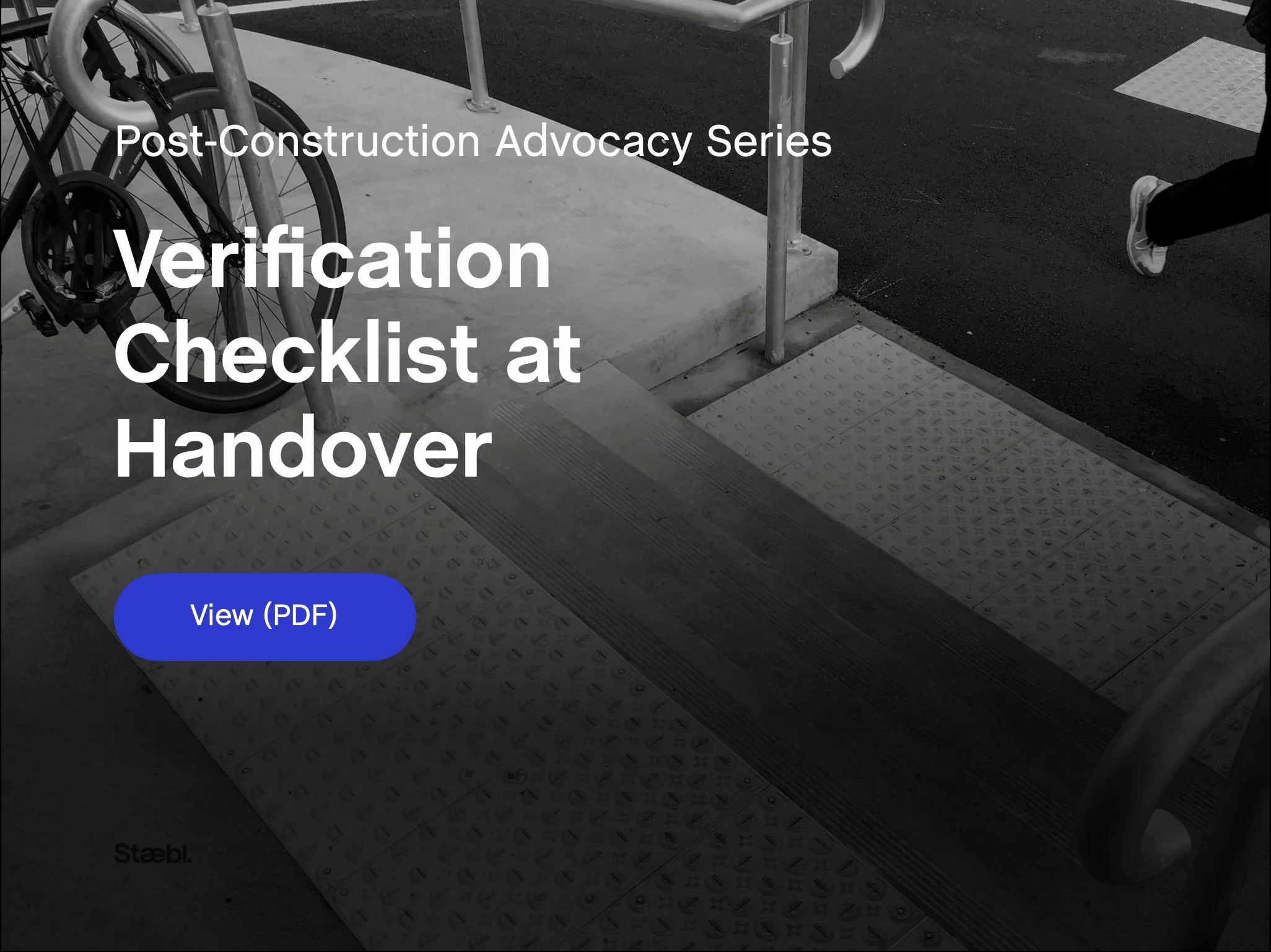 Verification Checklist at Handover banner image showing a completed pedestrian crossing interface with tactile ground surface indicators, ramped access, handrails and surrounding street elements.