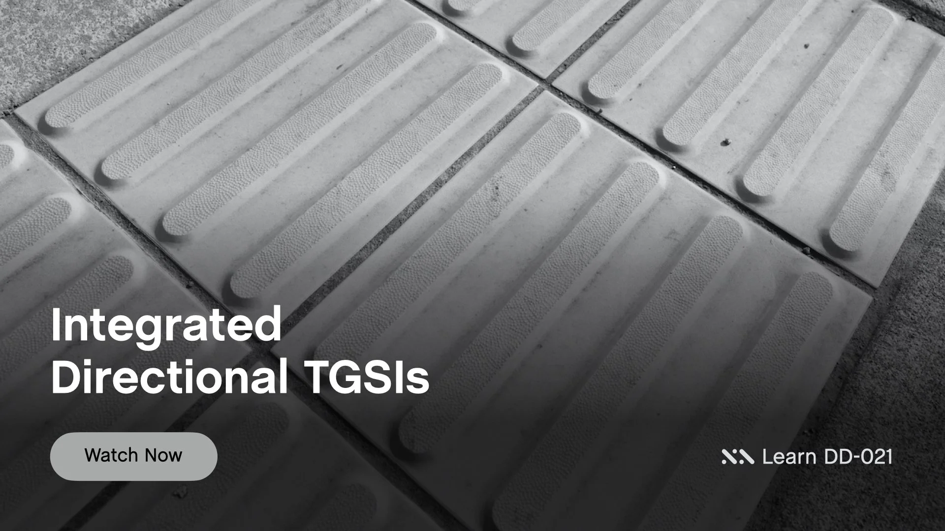 Staebl Academy - Integrated Directional TGSIs - Close-up of tactile paving tiles with raised truncated bars, used as directional cue for vision impaired persons, with overlay text 'Integrated Directional TGSIs' and a button labeled 'Watch Now'.