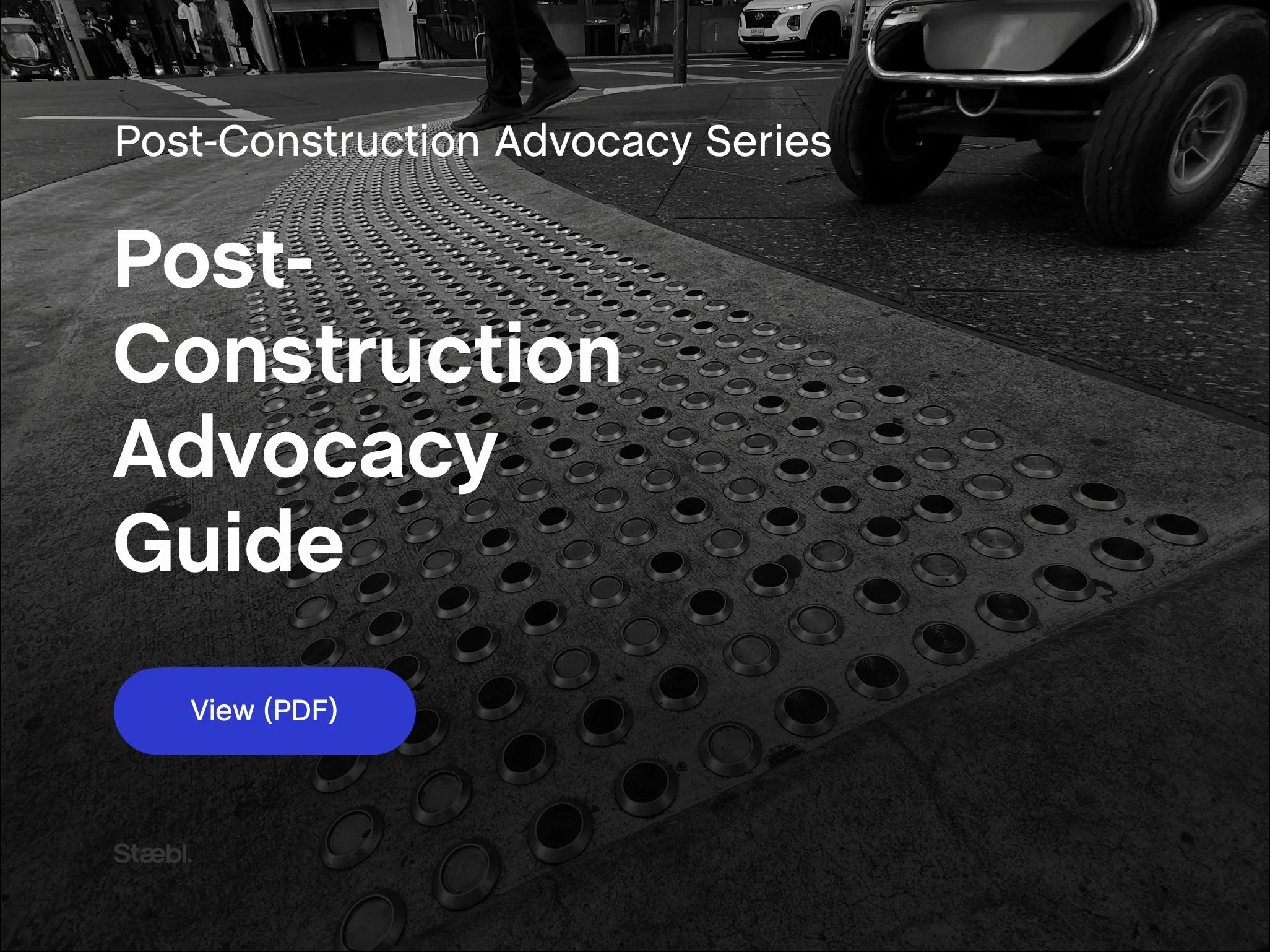 Post-Construction Advocacy Guide banner image showing discrete tactile ground surface indicators installed at a kerb ramp and pedestrian crossing, representing post-construction review of accessibility, compliance and design intent.