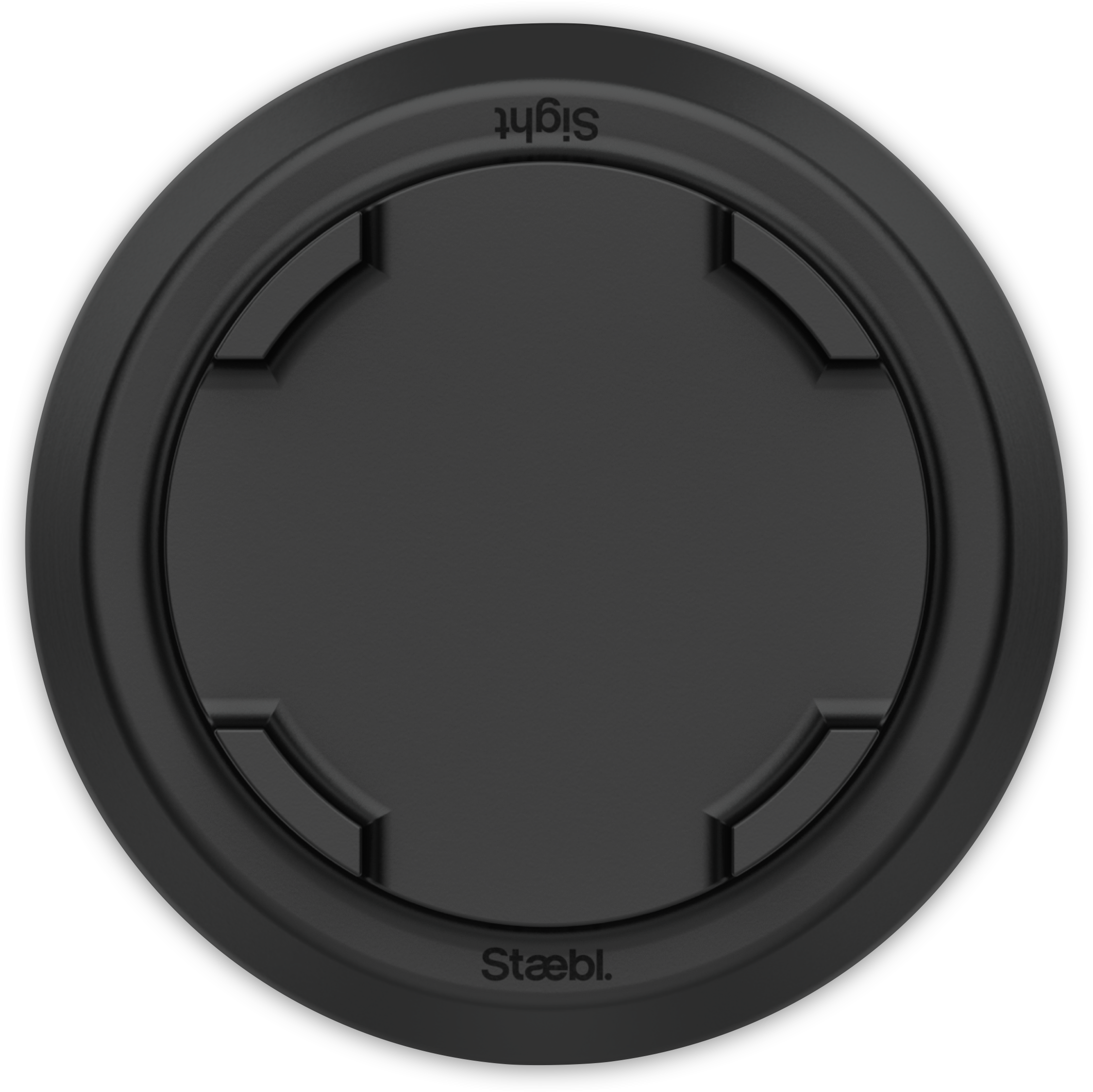Close-up of a black circular object with the word 'Slagt' at the top and 'Staebl' at the bottom, against a black background.