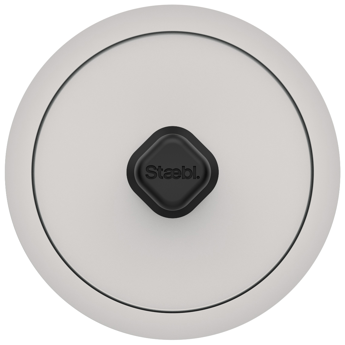 Close-up of a round, white electronic device with a black, diamond-shaped button in the center labeled 'Staebl.'