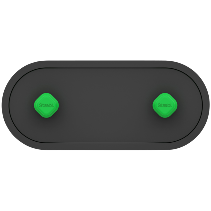 Top view of a black oval device with two green buttons labeled 'Staebl.'