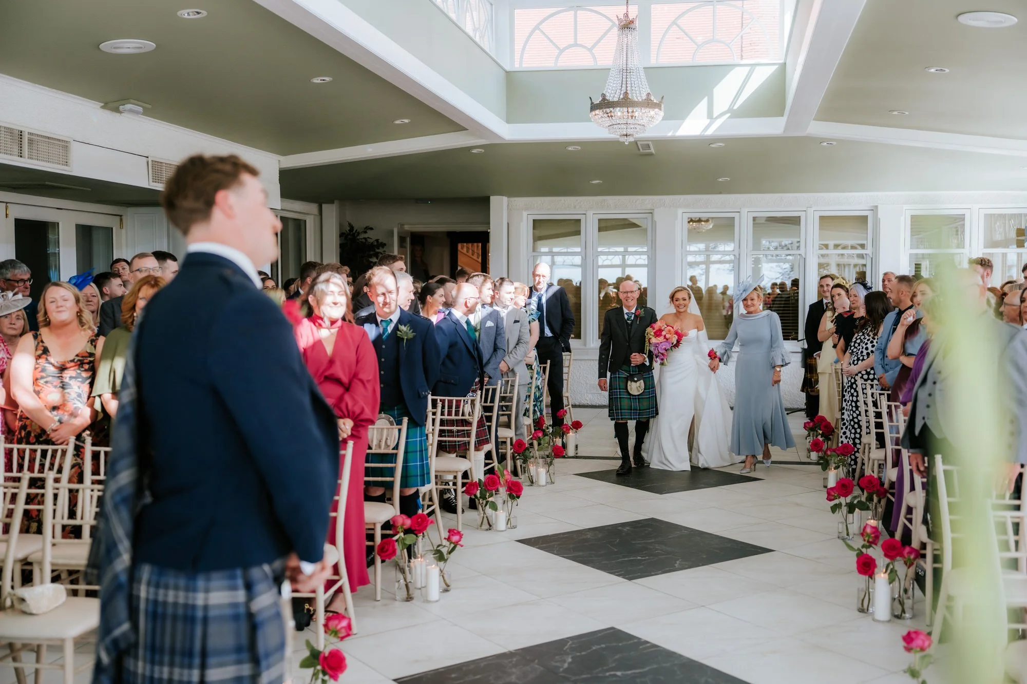 Fiona arriving for the ceremony with Connor waiting in the foreground.