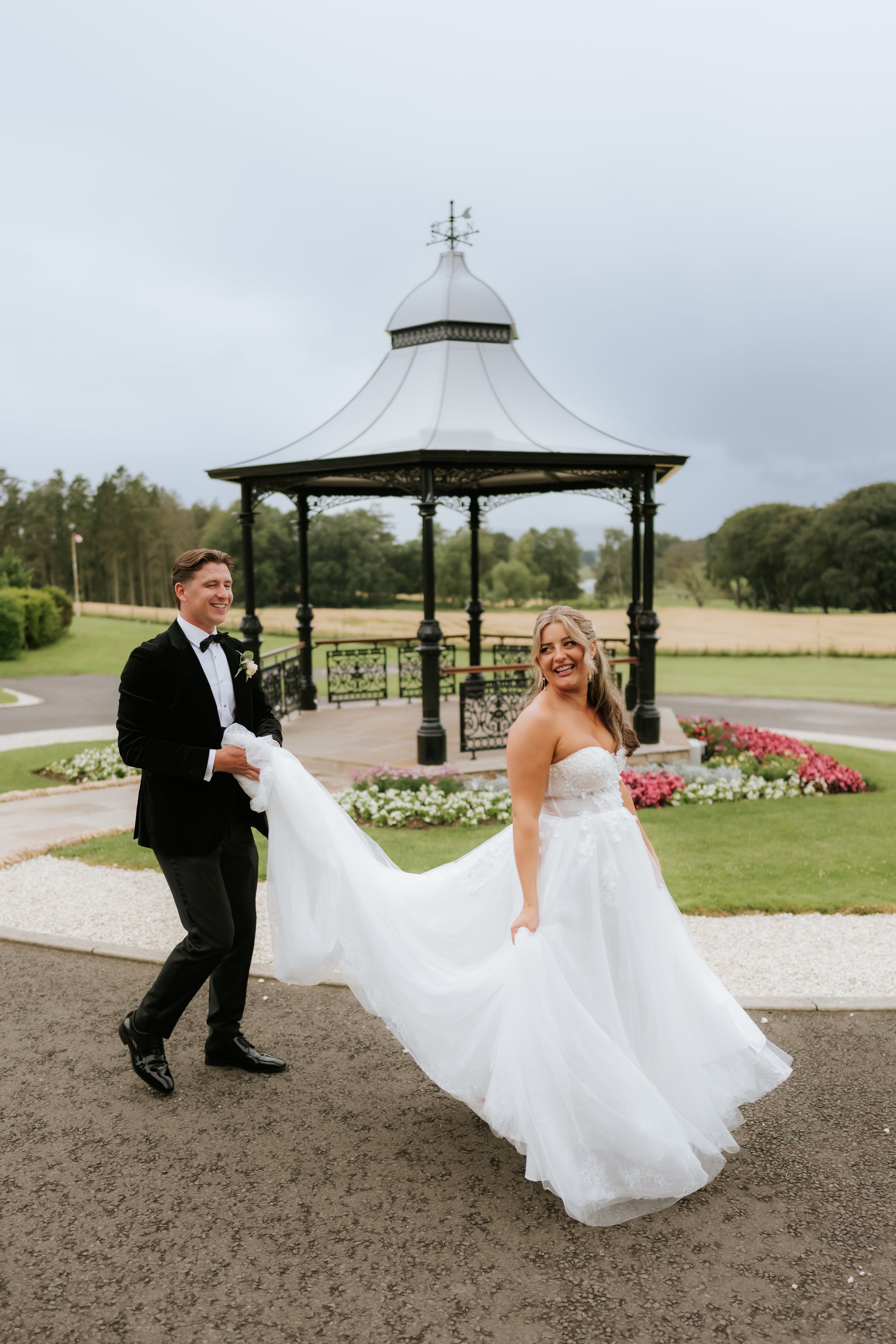 Emma and Frazer walking beside Cornhill Castle’s outdoor bandstand.