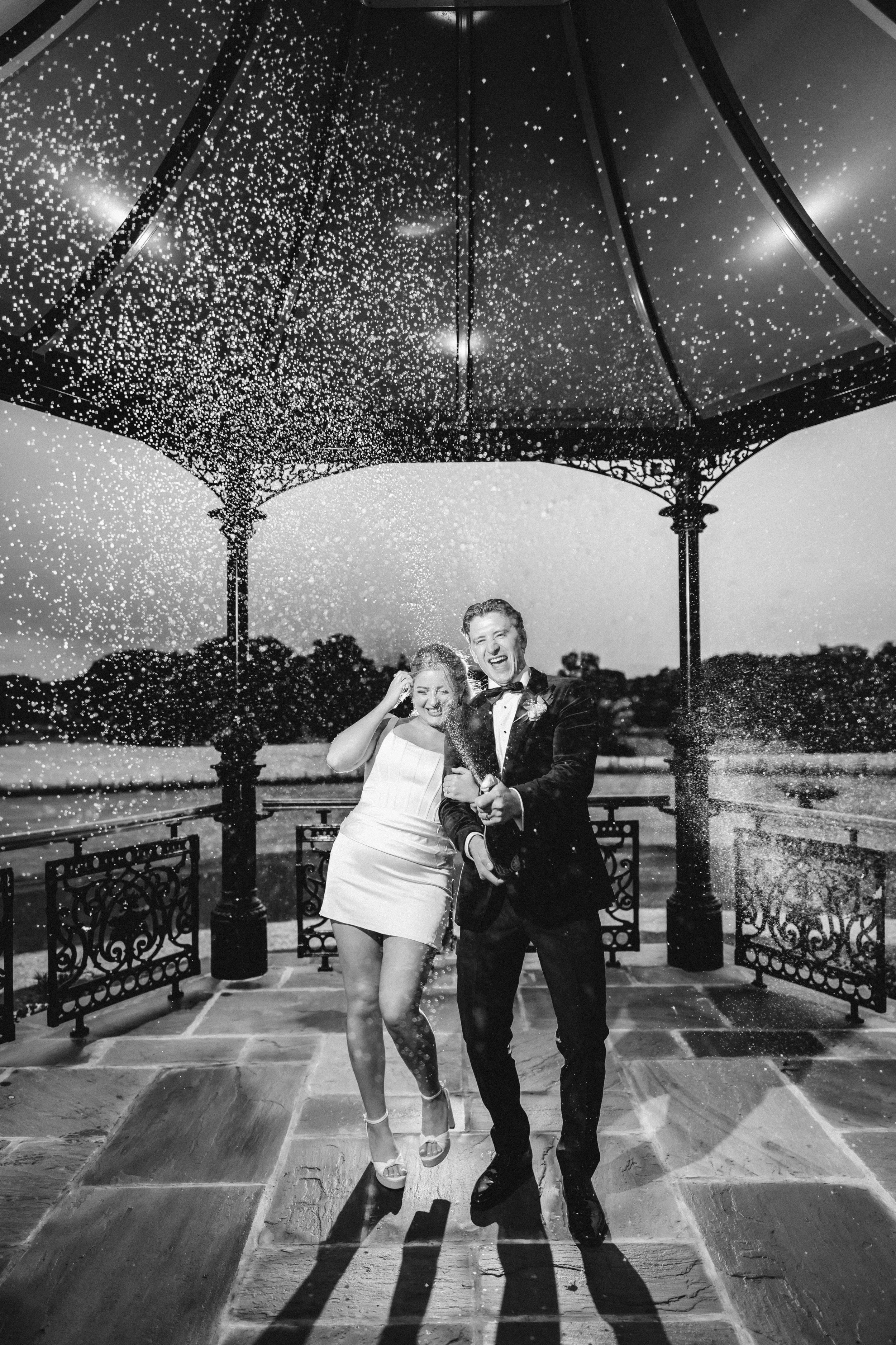 Emma and Frazer beneath Cornhill Castle’s bandstand in the evening rain.