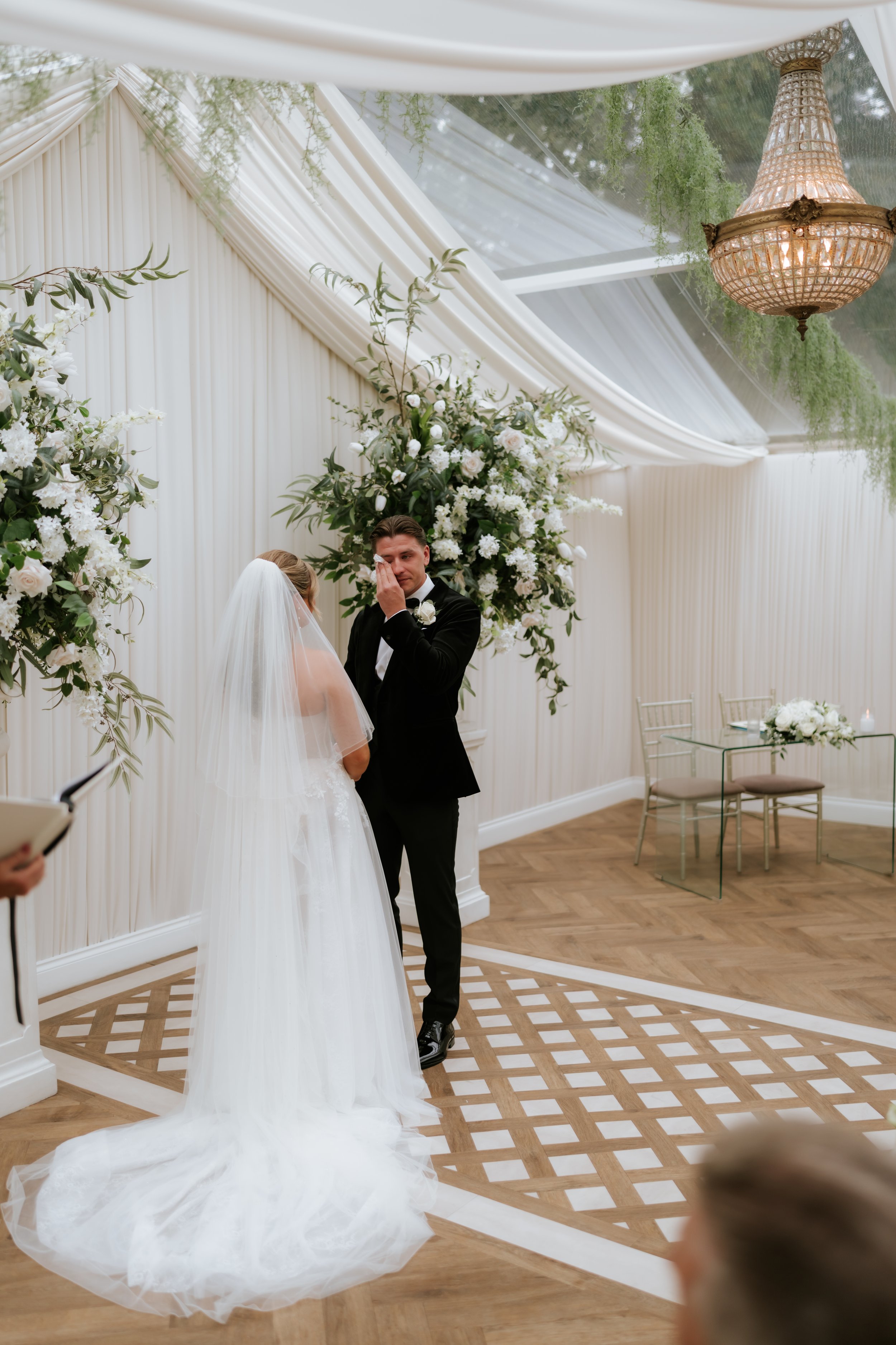 Emma and Frazer together during their pavilion wedding ceremony.