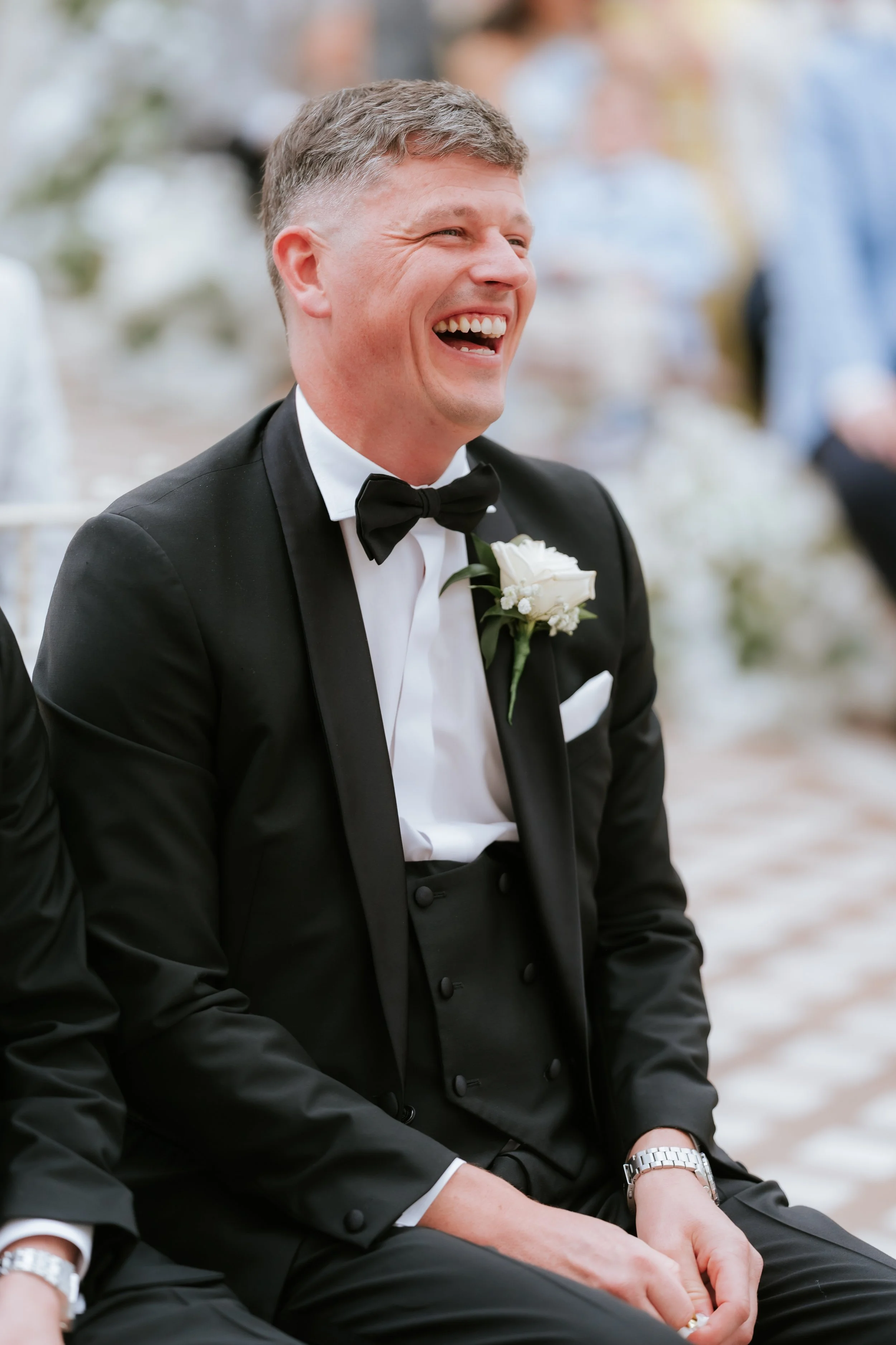 A guest laughing during Emma and Frazer’s wedding celebrations.