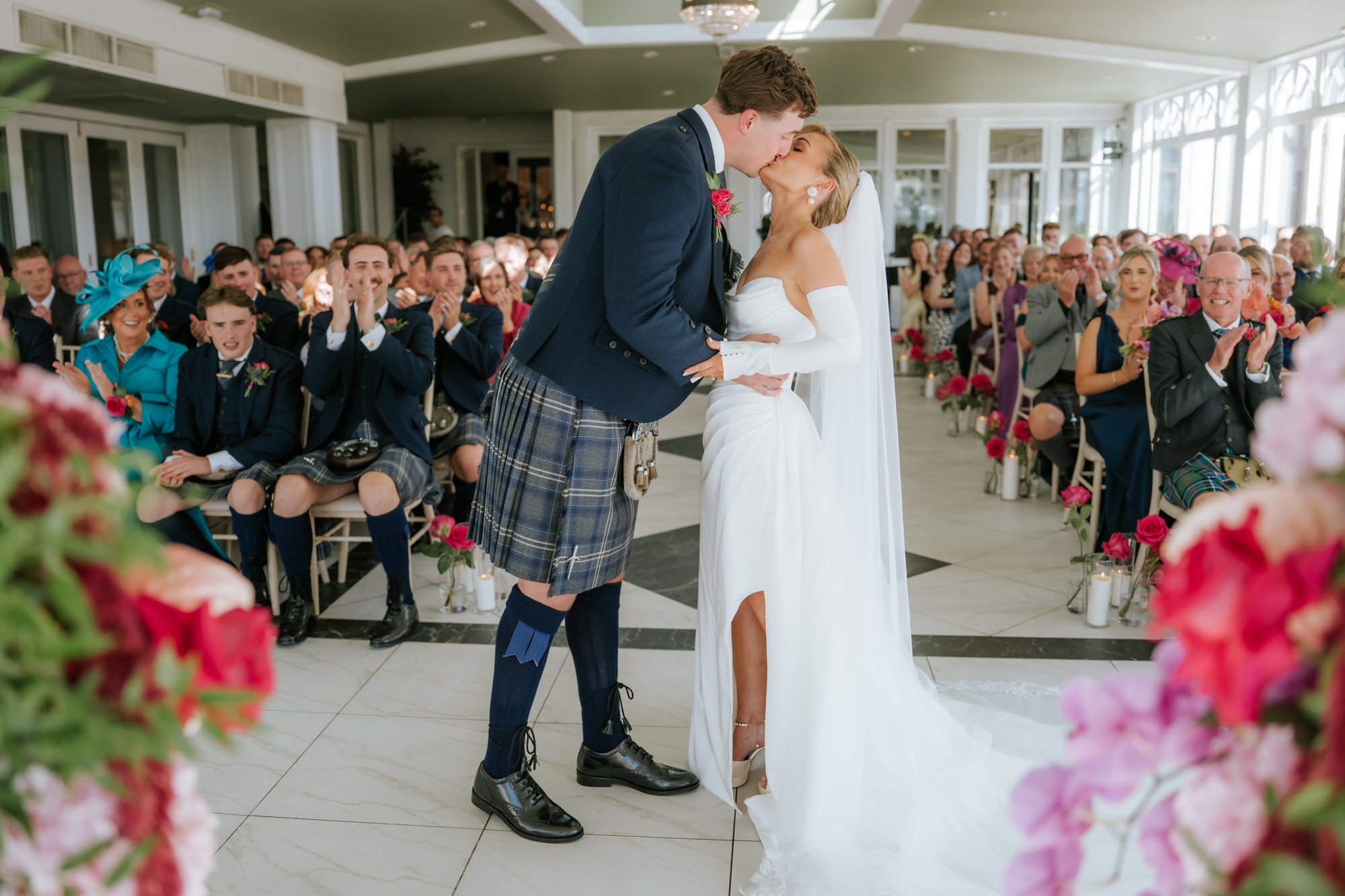 Fiona and Connor sharing their first kiss as a married couple.