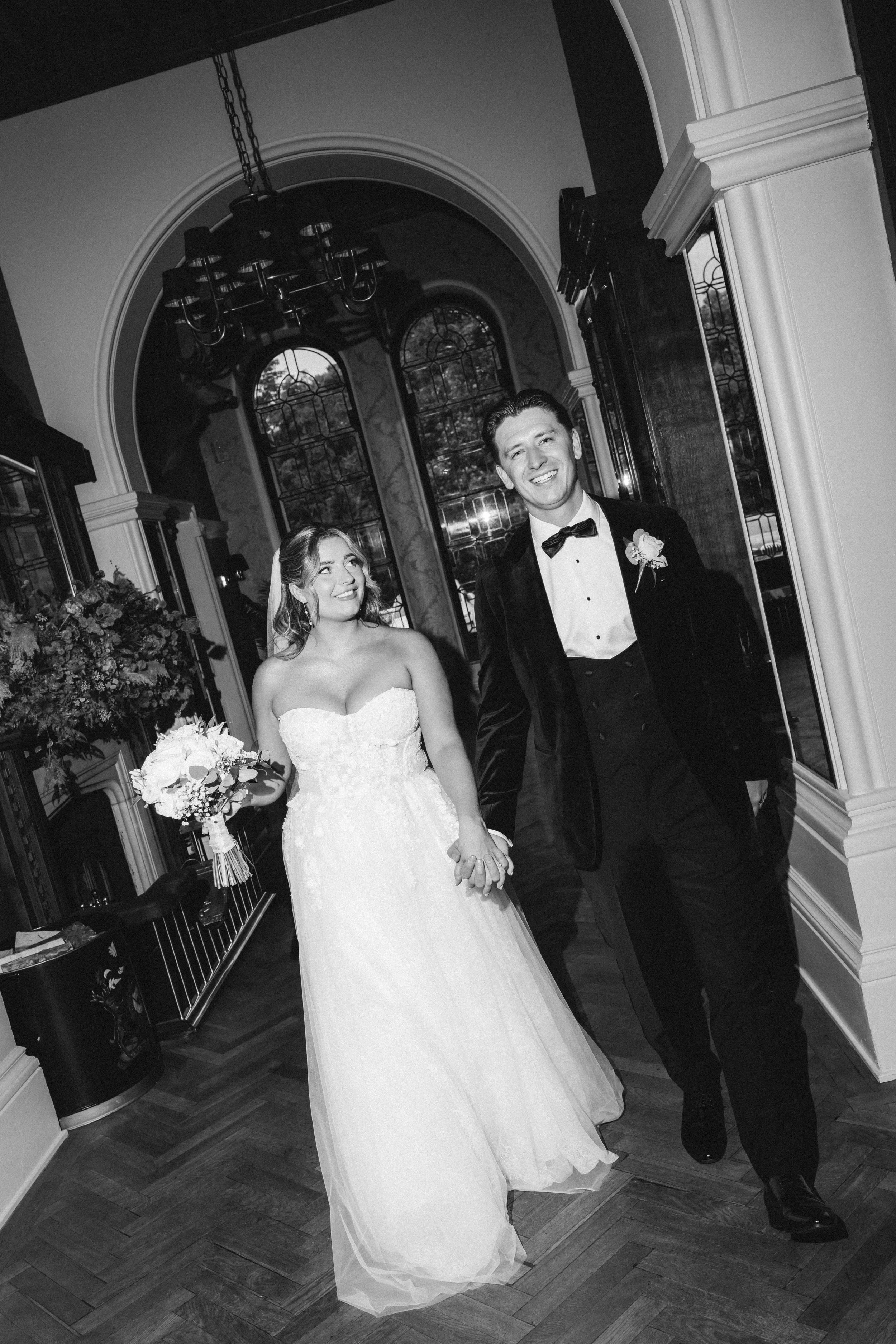 Emma and Frazer making an entrance together at Cornhill Castle, photographed in black and white.