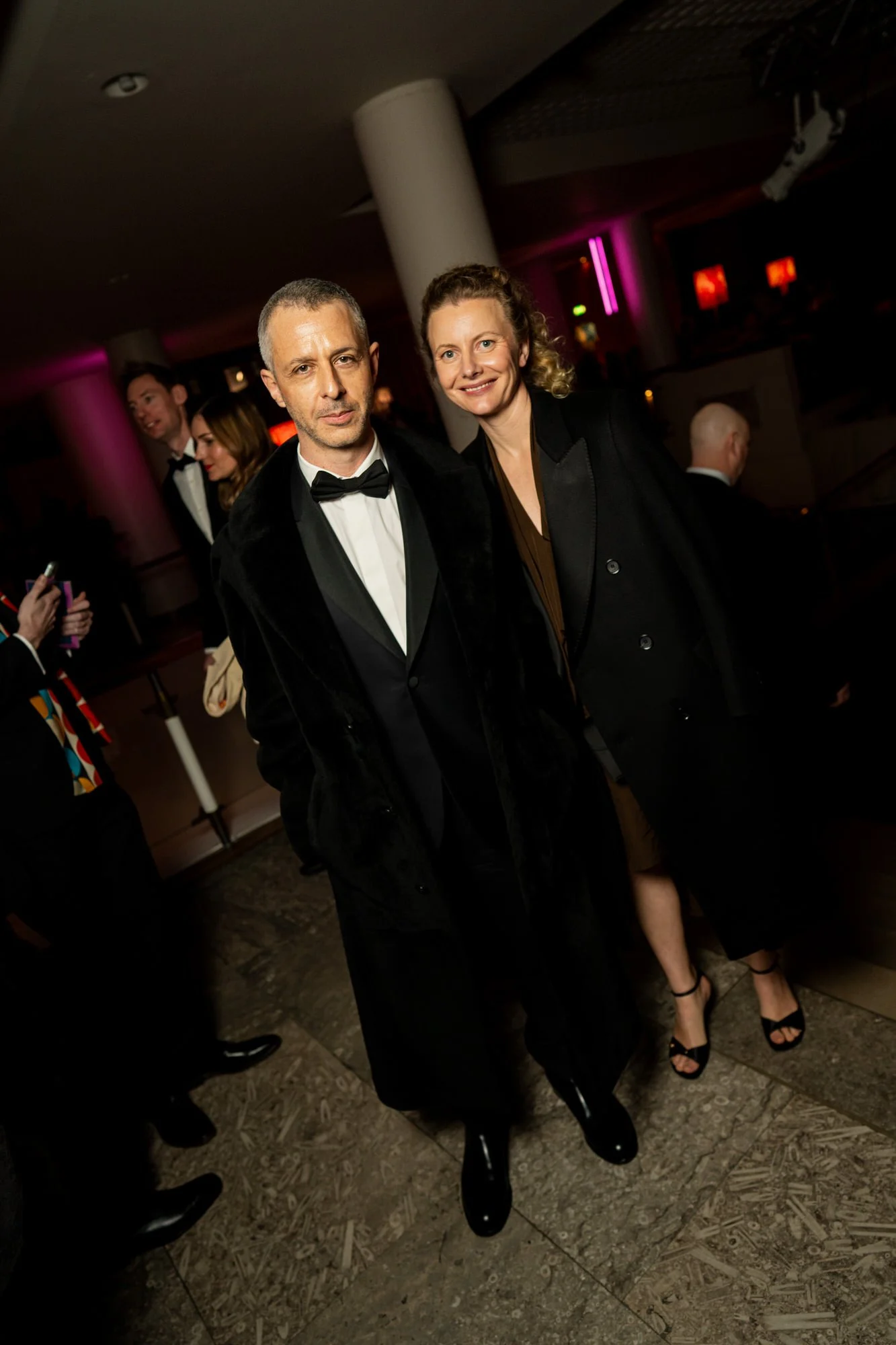 Jeremy Strong posing with a guest at the BAFTA Film Awards reception.