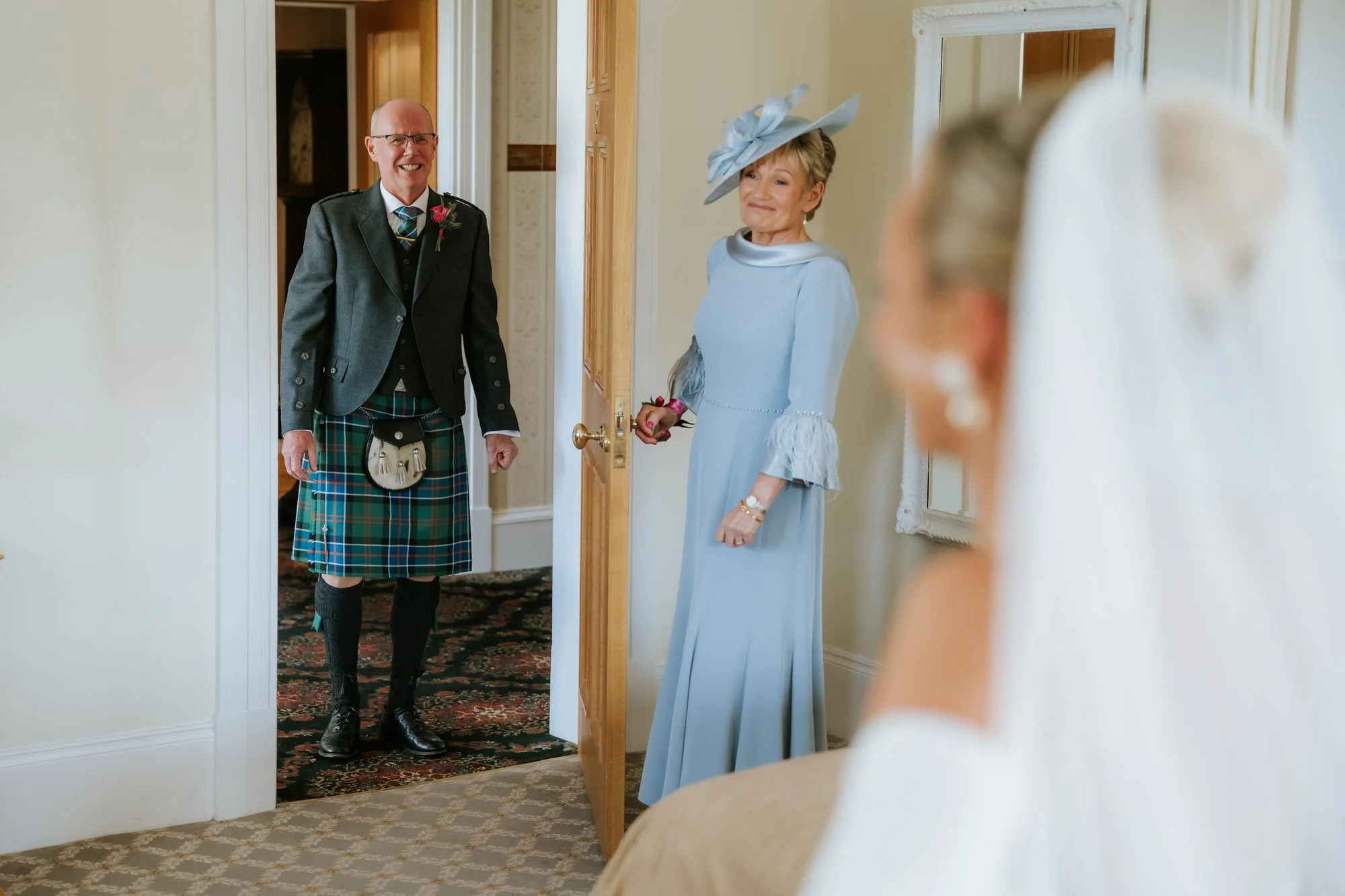 Fiona’s parents seeing her in her wedding dress.