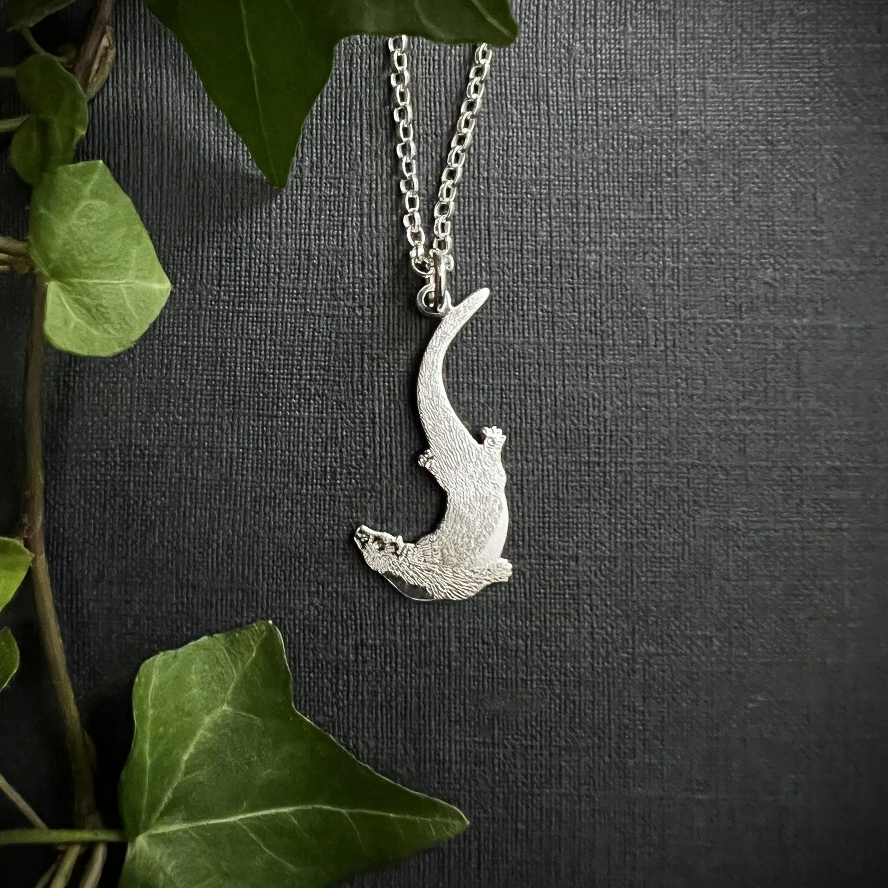 SWIMMING OTTER PENDANT