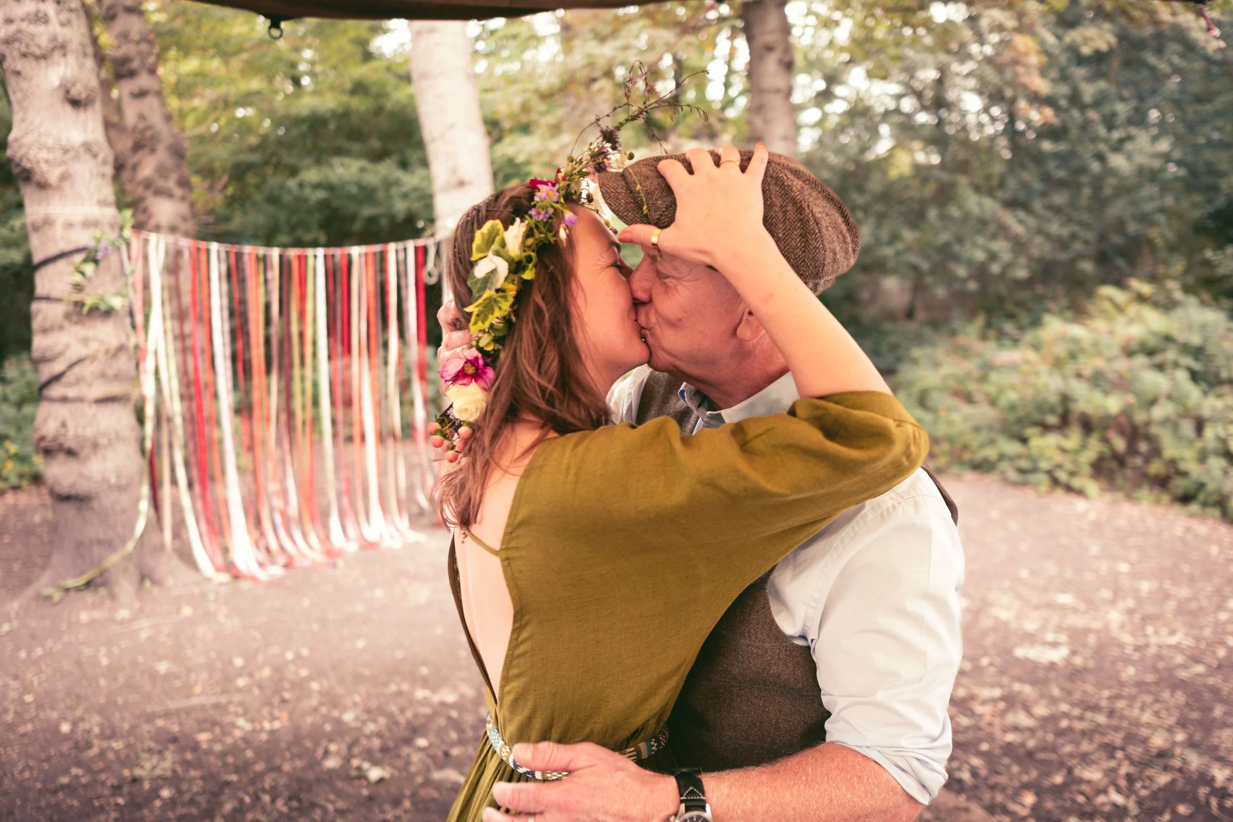 Couple kiss at hand fasting pagan ceremony