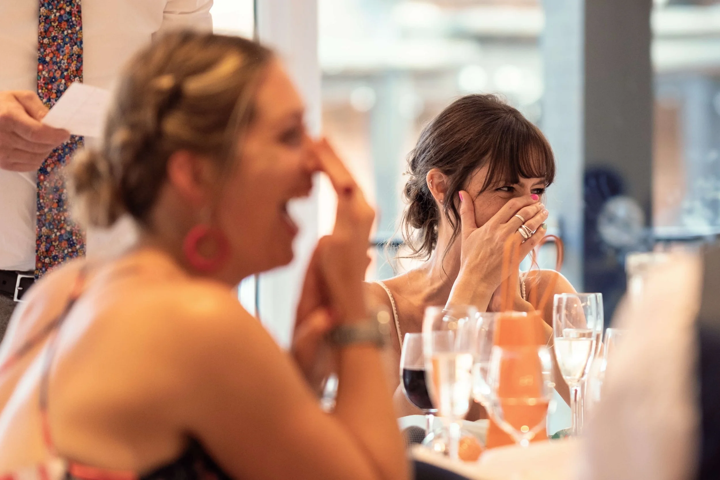 Bride laughing during speech