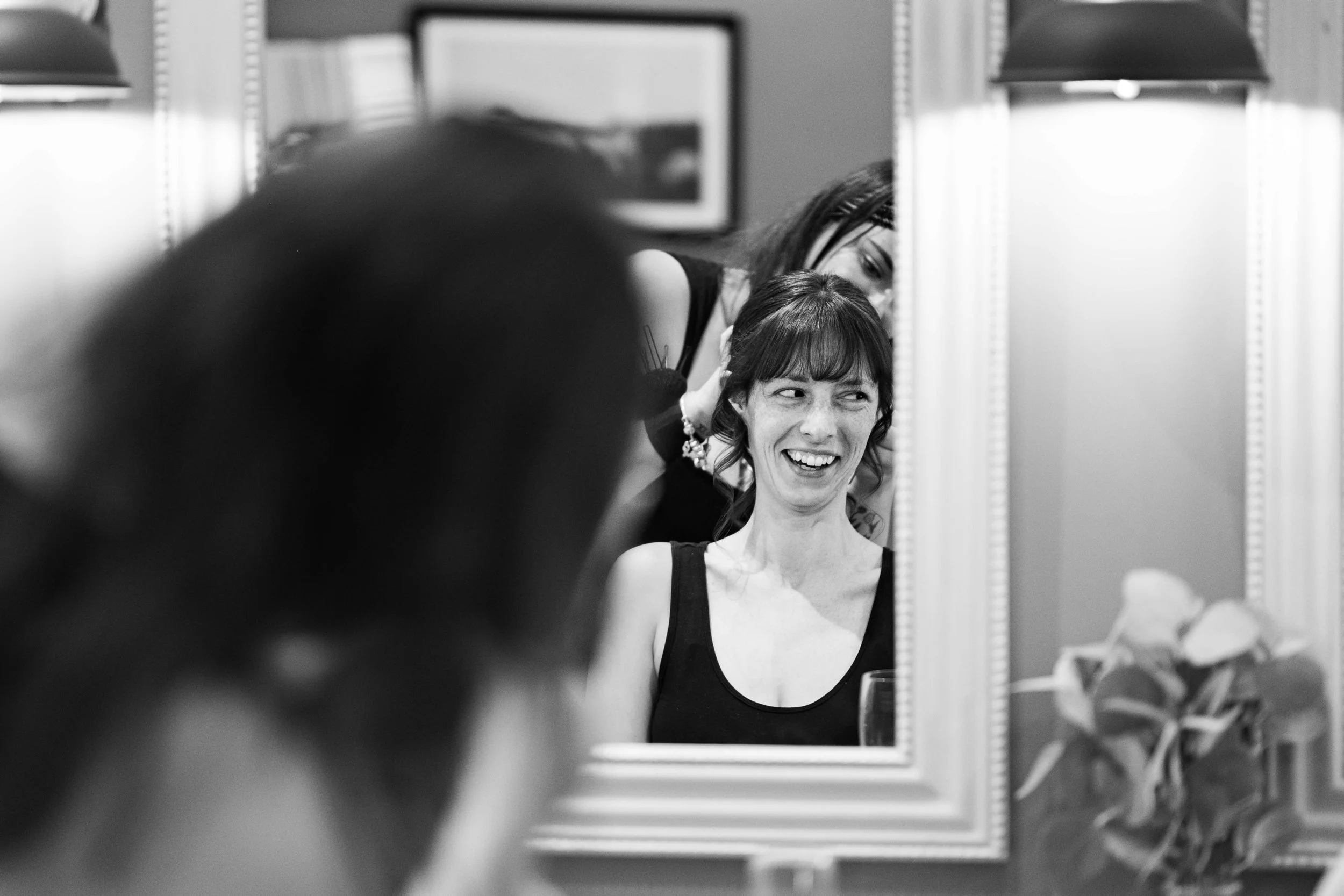 brides smiling during bridal prep