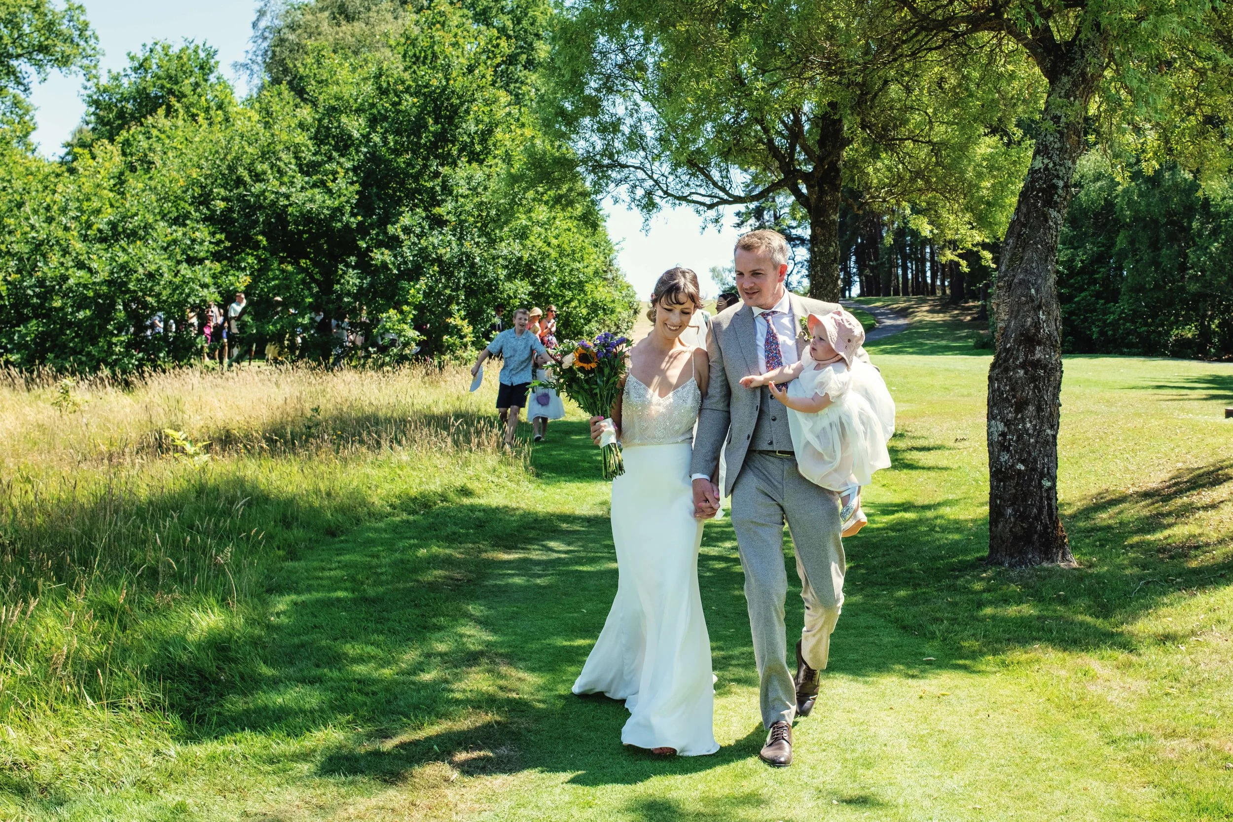 Bride and groom lead wedding party