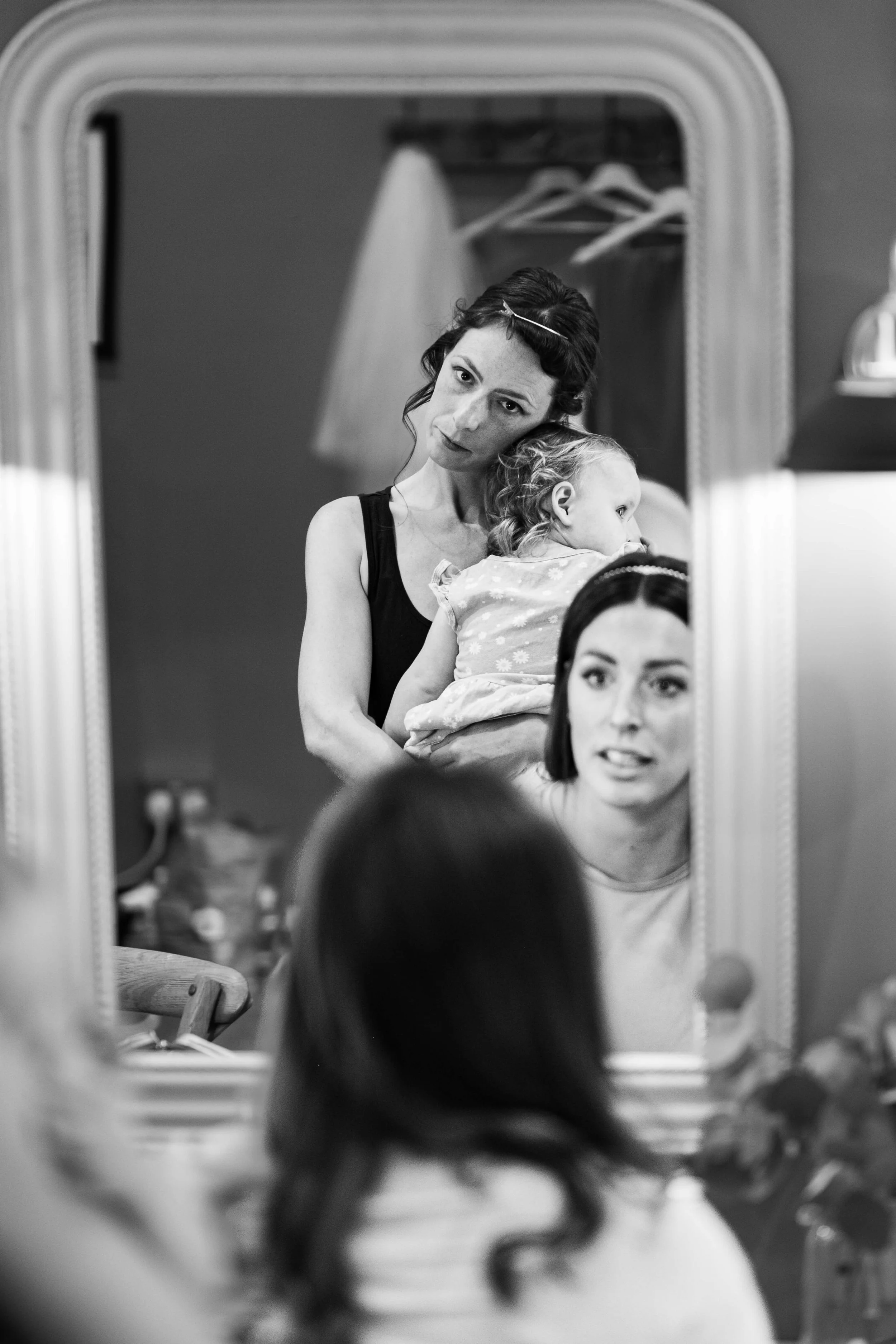 nervous bride with child and bridesmaid