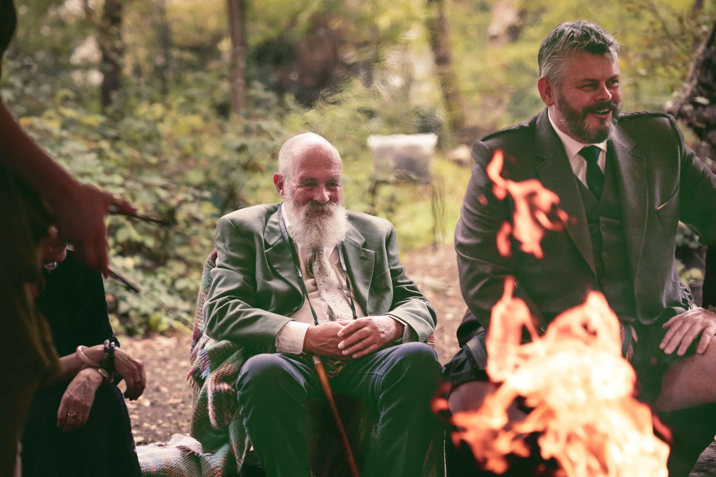 wedding guest around open fire