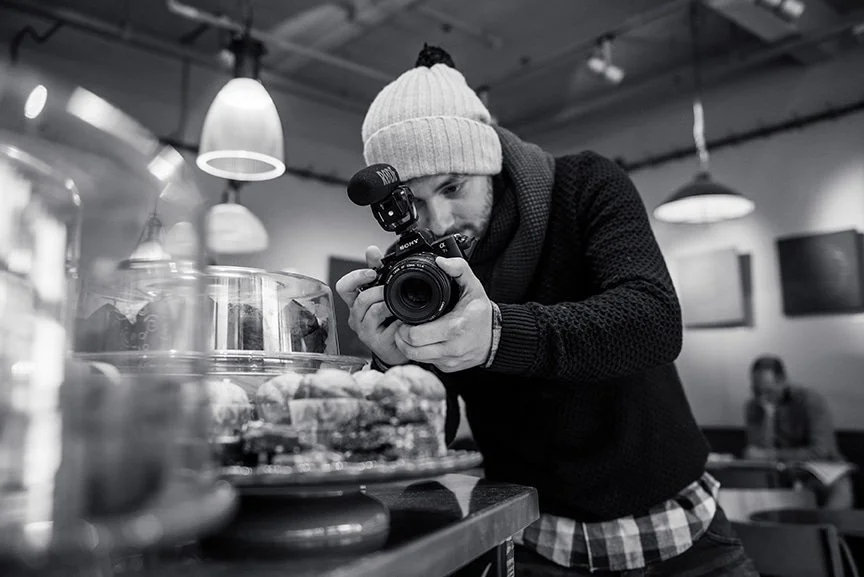 Aaron Child of Painted Life filming in a Shrewsbury coffee shop.