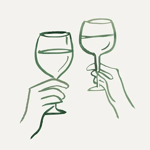 Two hands holding wine glasses clinking together