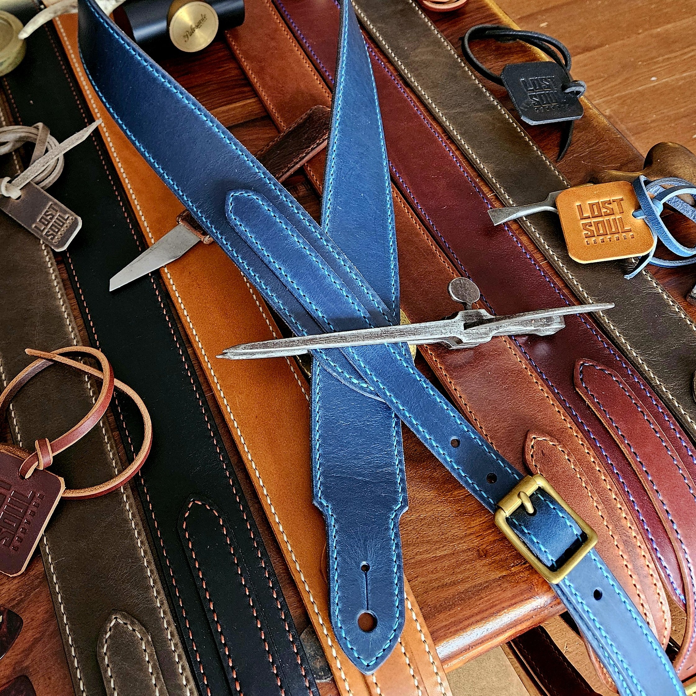 Hand made leather guitar strap. Hand stitched. Solid brass buckle. Made in UK.