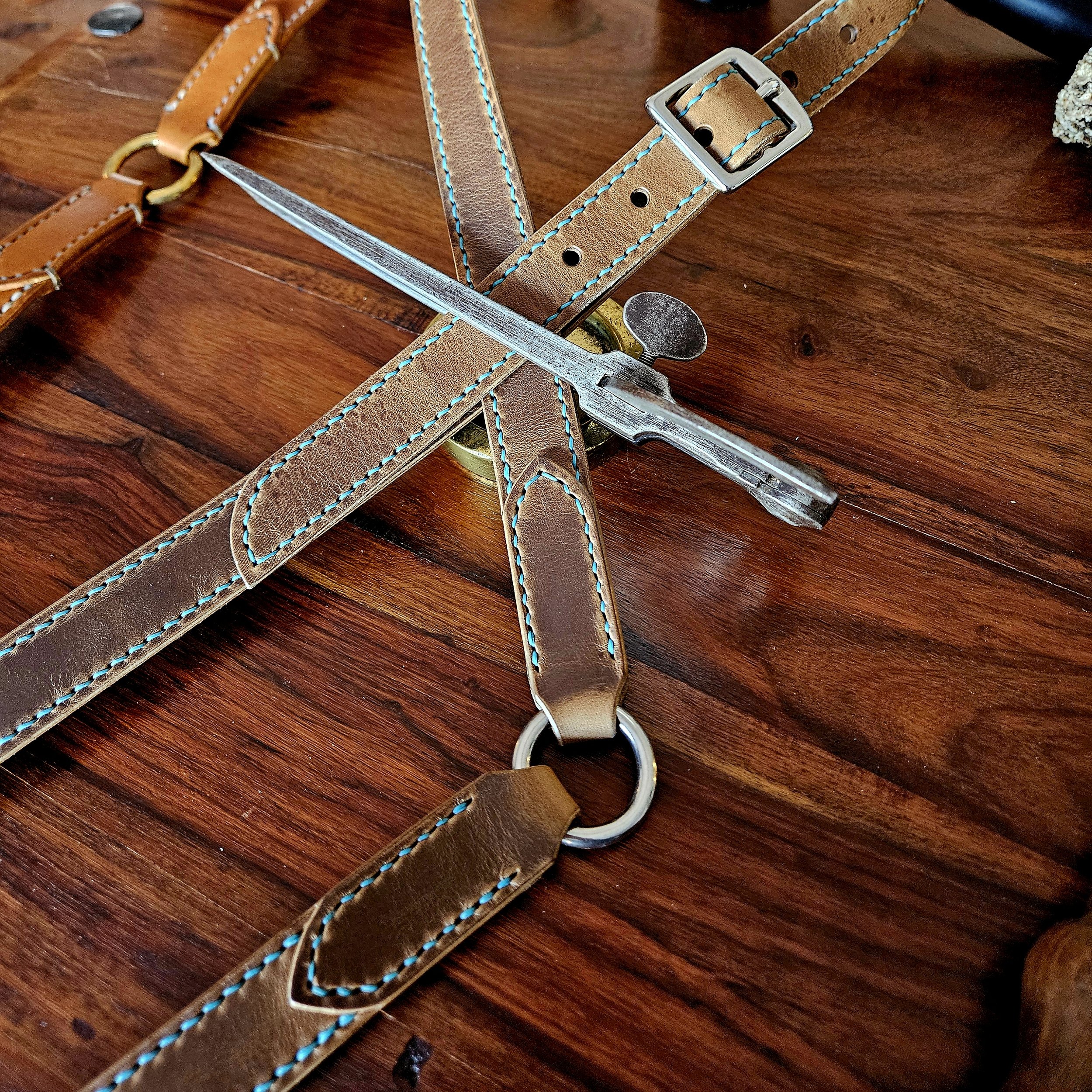 Hand made, hand stitched leather guitar strap. Highest quality UK sourced leather. Made to measure. Decorative ring design.