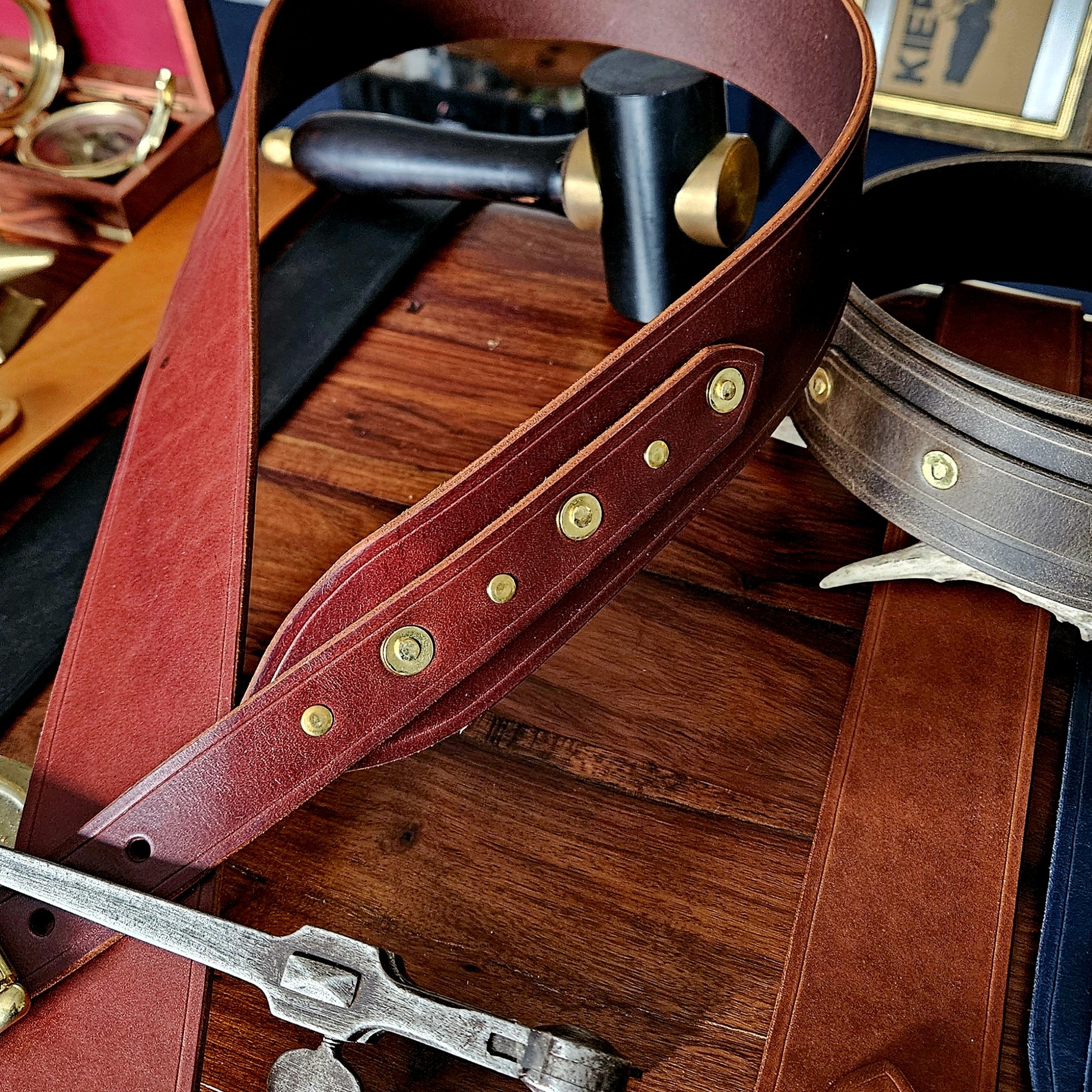 Hand made leather guitar strap. Solid Brass Buckle. Riveted. Made in UK.