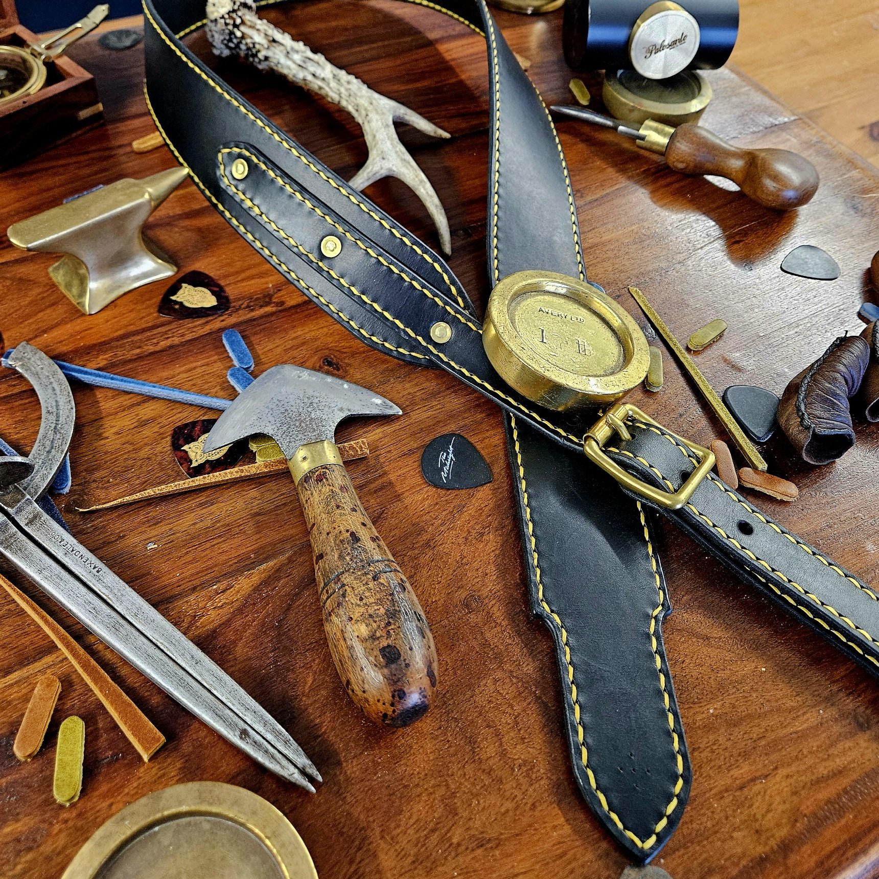 Hand made leather guitar strap. Hand stitched. Solid brass buckle. Made in UK.