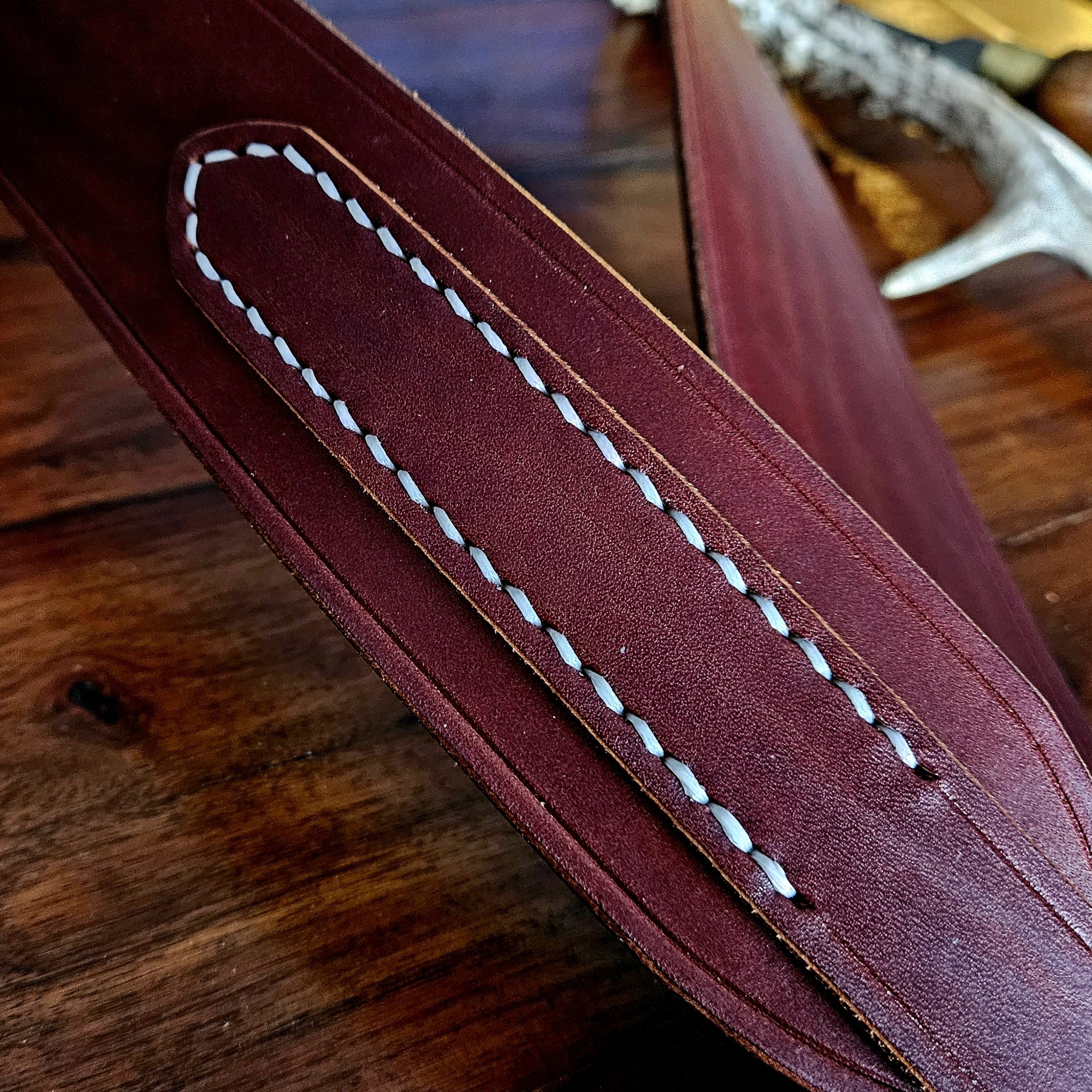 Hand made leather guitar strap. Hand stitched. Solid brass buckle. Made in UK.