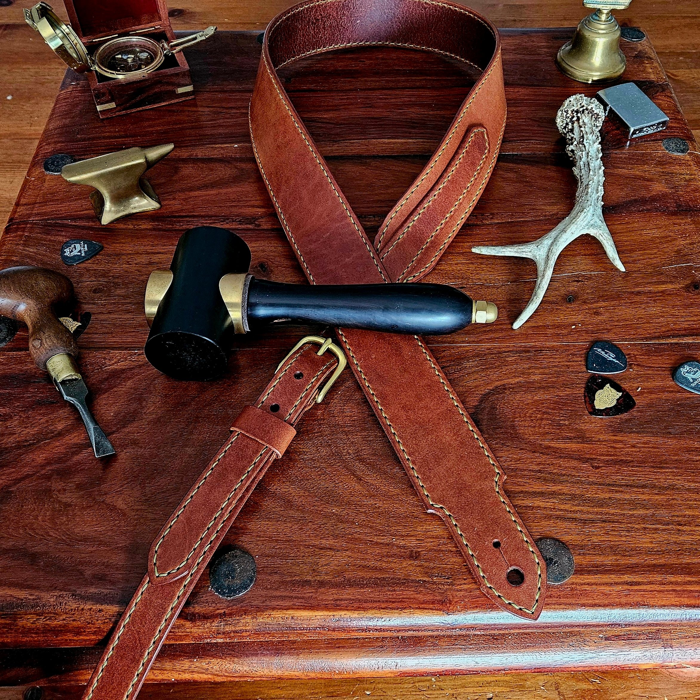 Hand made leather guitar strap. Hand stitched. Solid brass buckle. Made in UK.