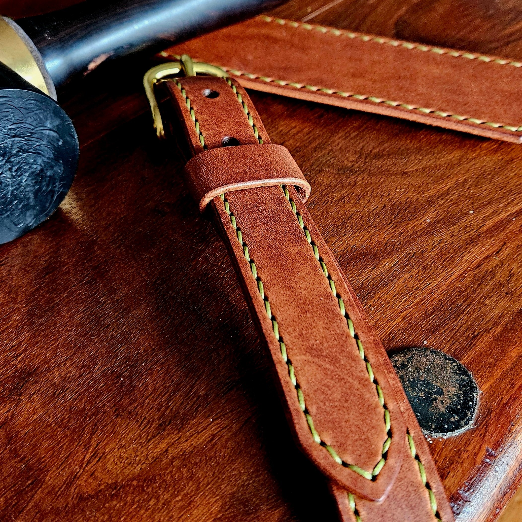Hand made leather guitar strap. Hand stitched. Solid brass buckle. Made in UK.
