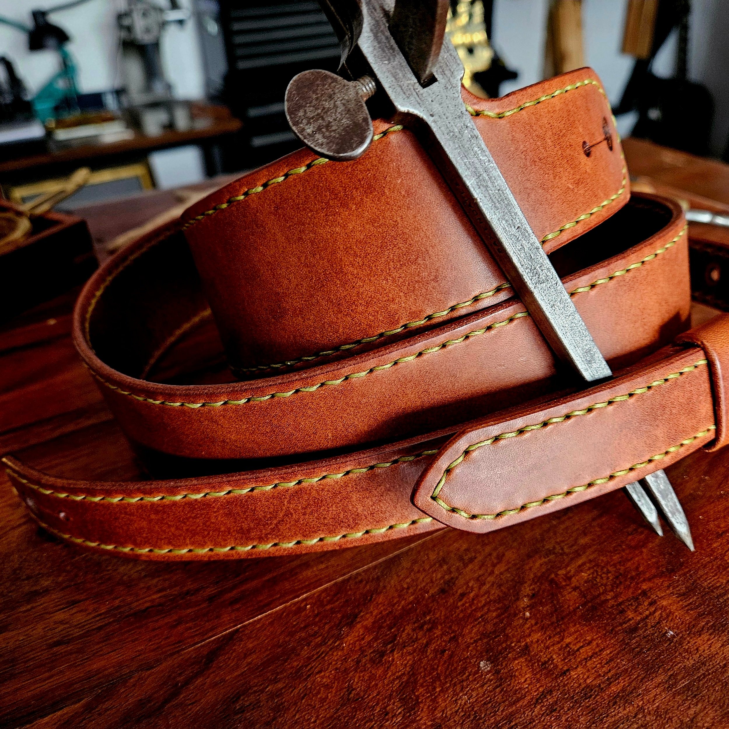 Hand made leather guitar strap. Hand stitched. Solid brass buckle. Made in UK.