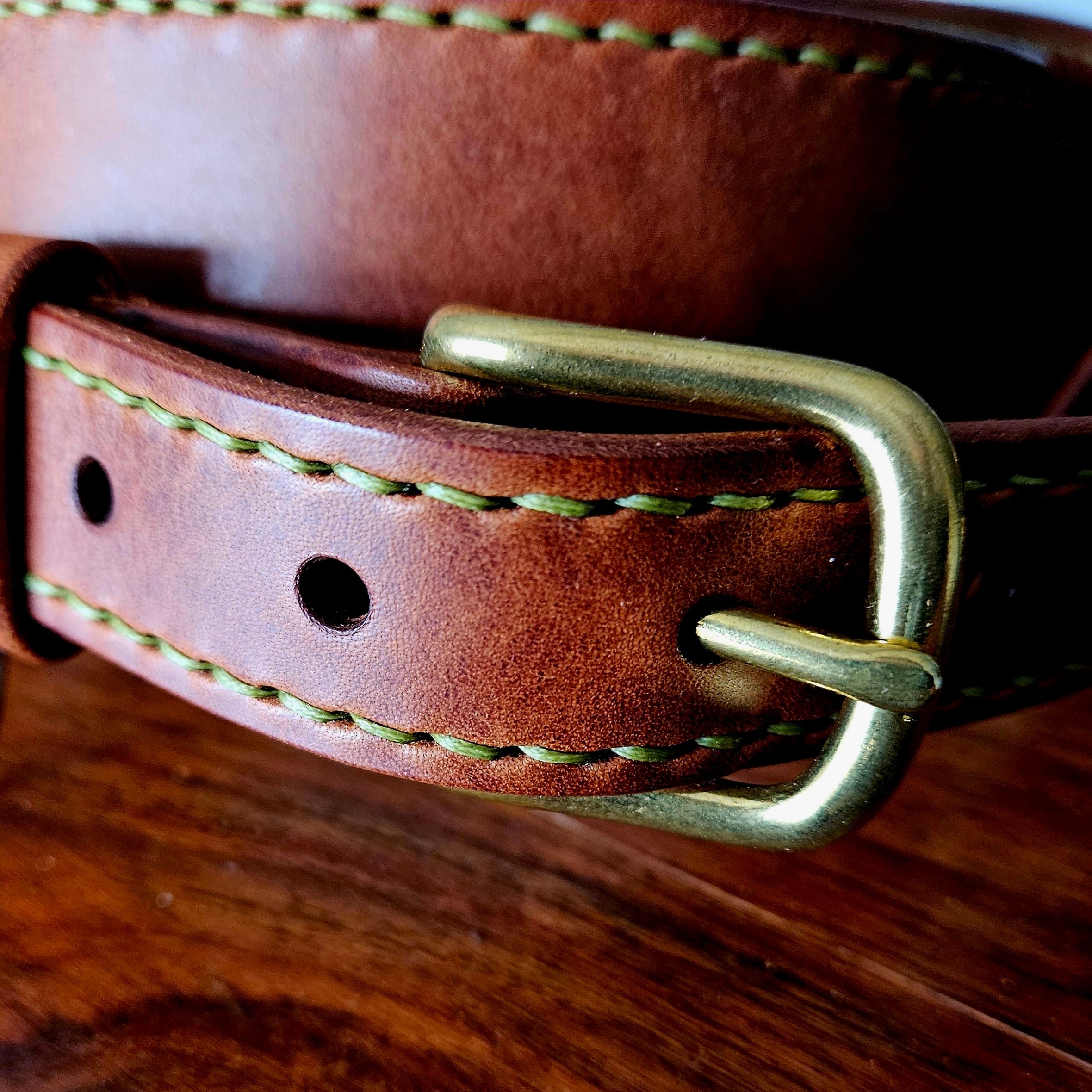 Hand made leather guitar strap. Hand stitched. Solid brass buckle. Made in UK.
