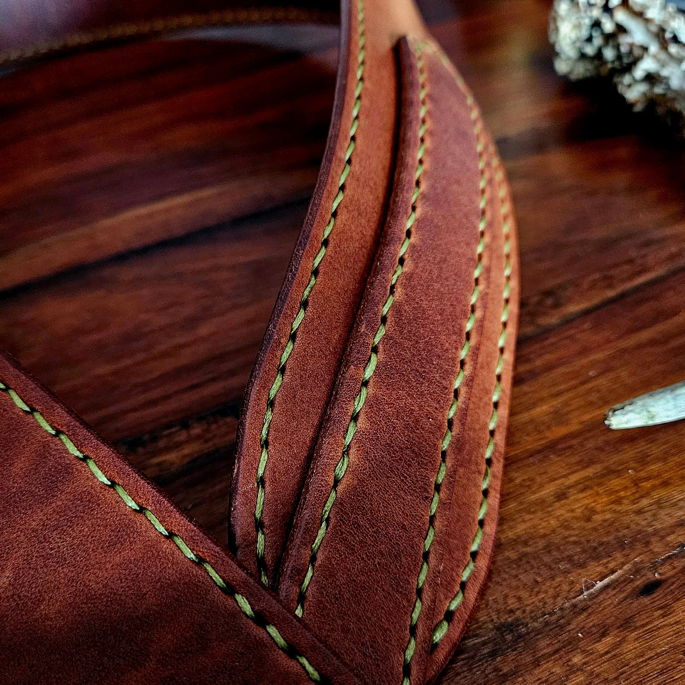 Hand made leather guitar strap. Hand stitched. Solid brass buckle. Made in UK.