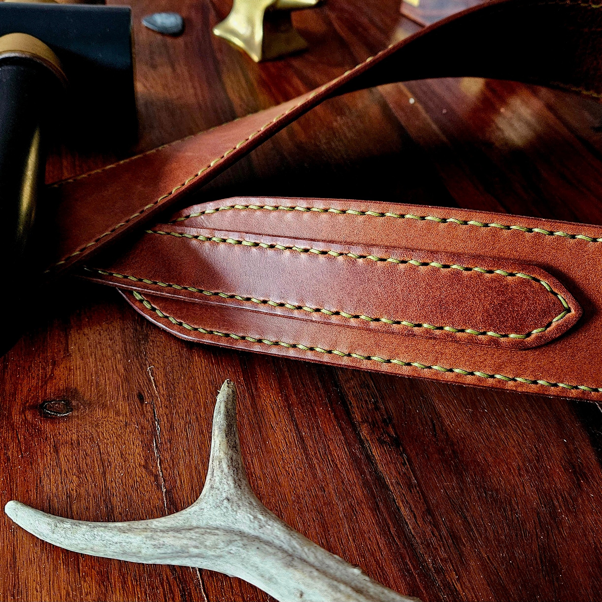 Hand made leather guitar strap. Hand stitched. Solid brass buckle. Made in UK.