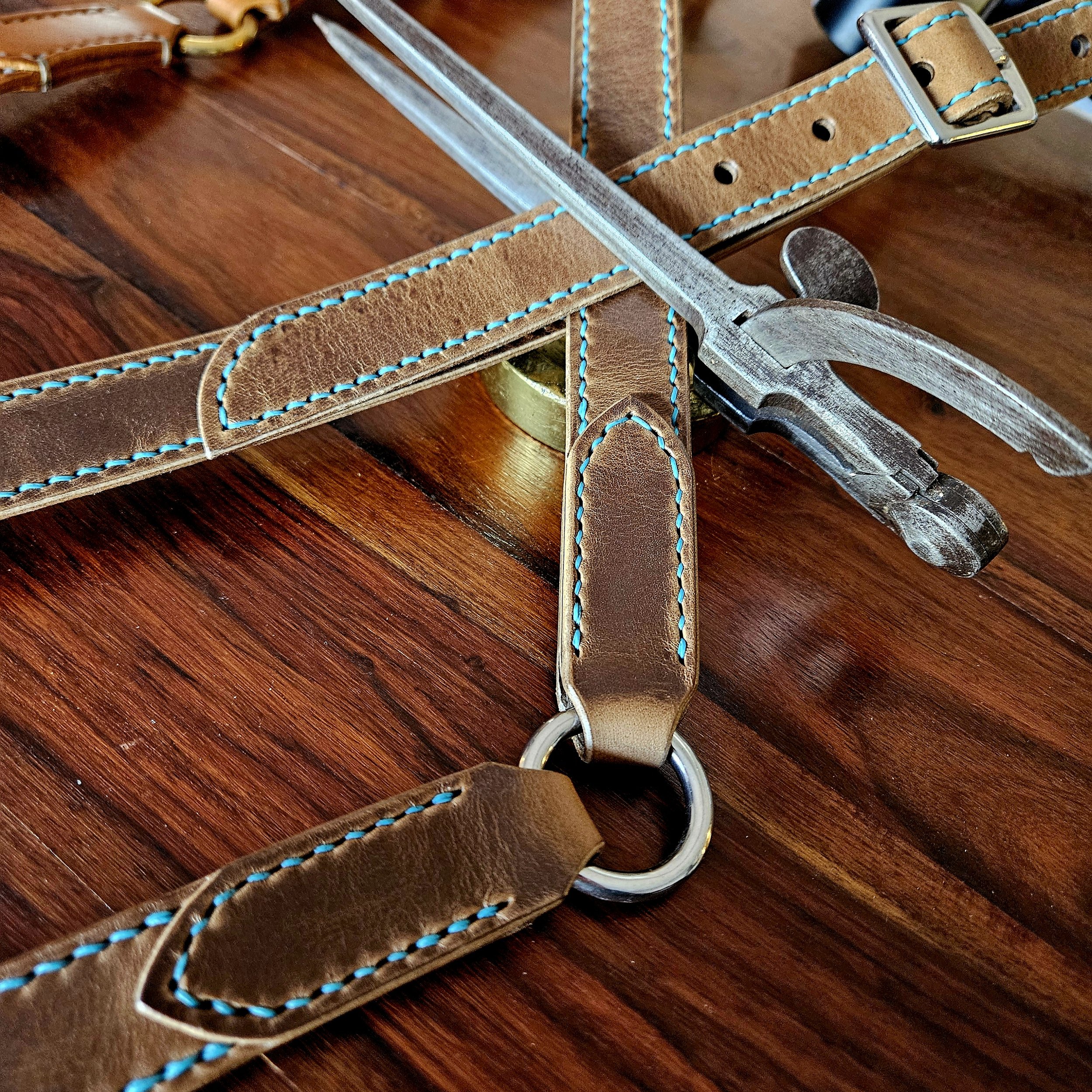 Hand made, hand stitched leather guitar strap. Highest quality UK sourced leather. Made to measure. Decorative ring design.