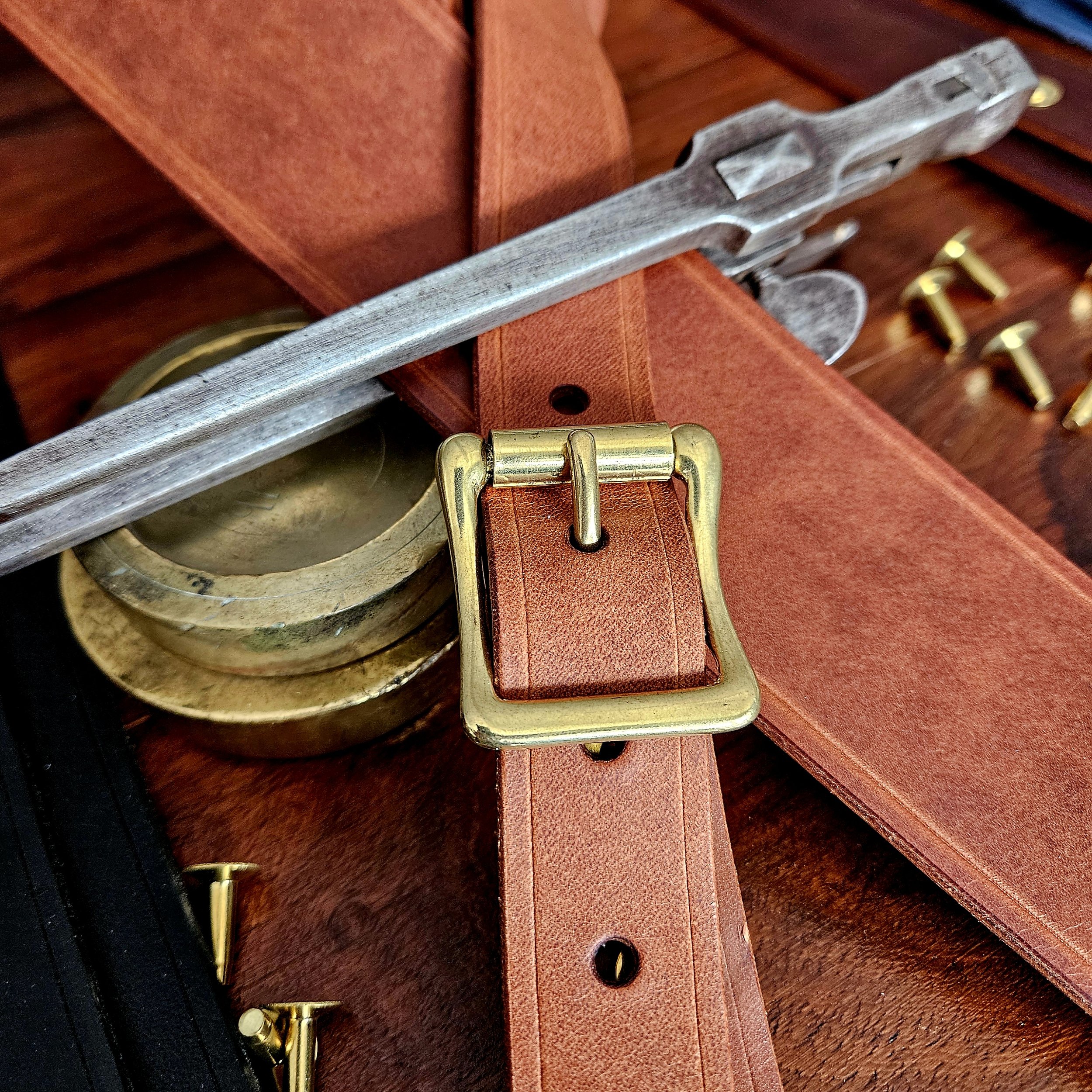 Hand made leather guitar strap. Solid Brass Buckle. Riveted. Made in UK.