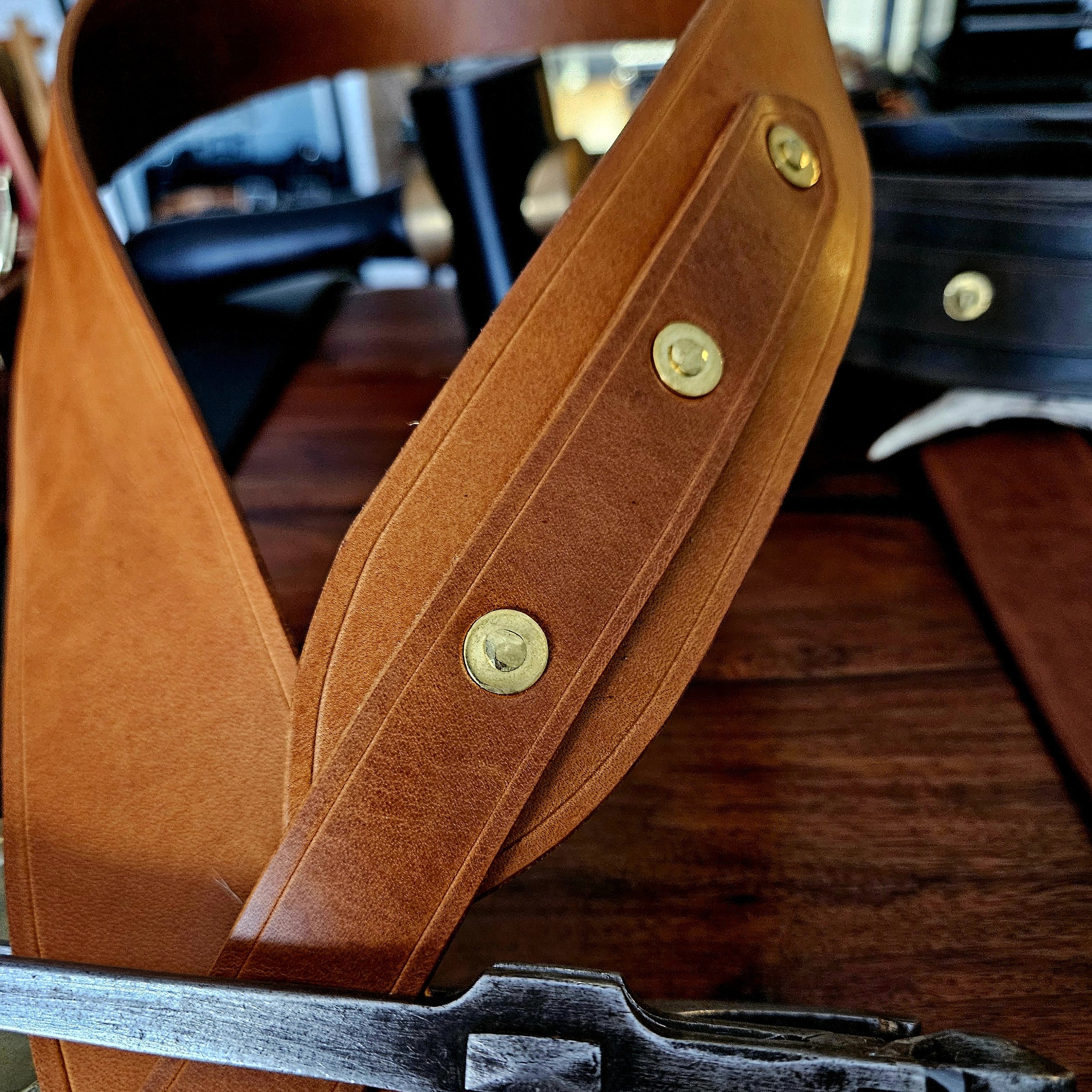 Hand made leather guitar strap. Solid Brass Buckle. Riveted. Made in UK.