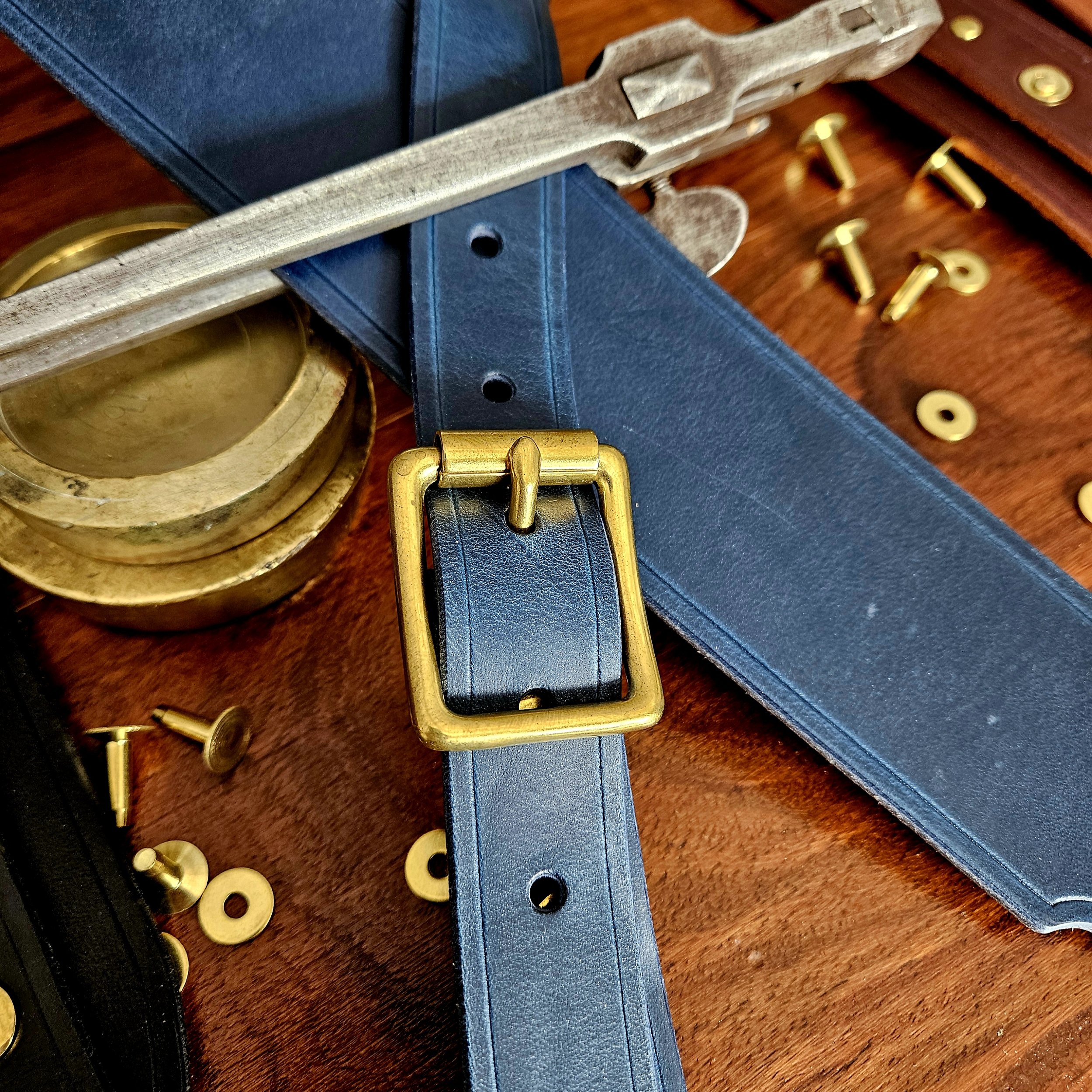 Hand made leather guitar strap. Solid Brass Buckle. Riveted. Made in UK.