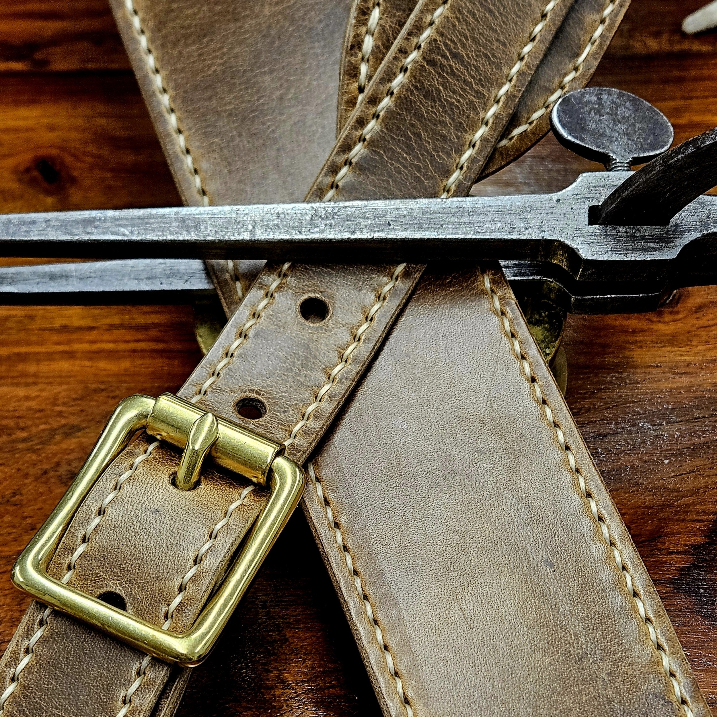 Hand made leather guitar strap. Hand stitched. Solid brass buckle. Made in UK.