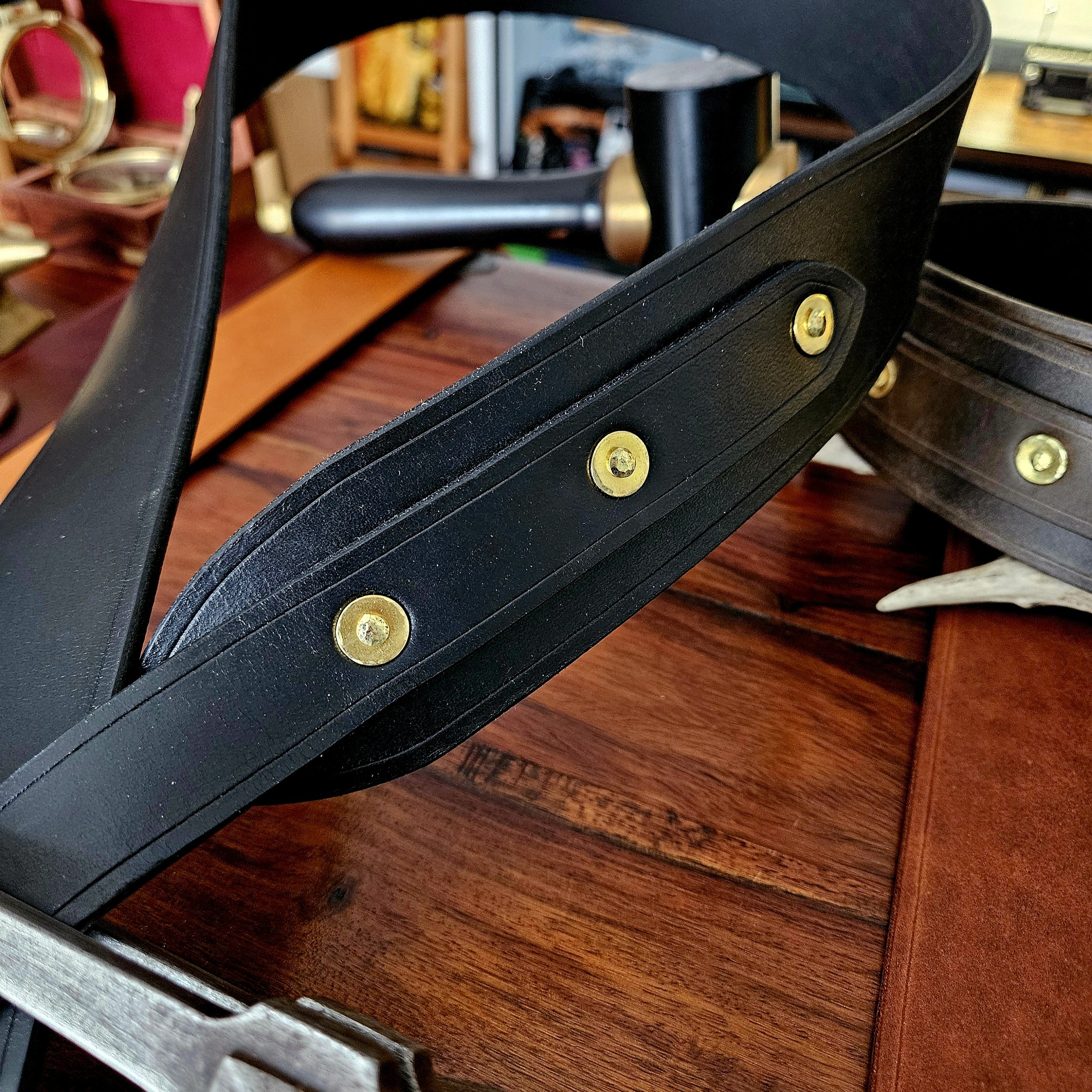 Hand made leather guitar strap. Solid Brass Buckle. Riveted. Made in UK.