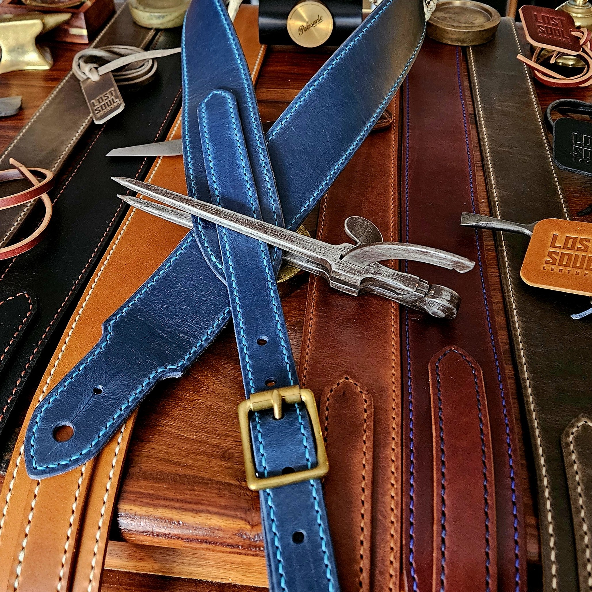Hand made leather guitar strap. Hand stitched. Solid brass buckle. Made in UK.